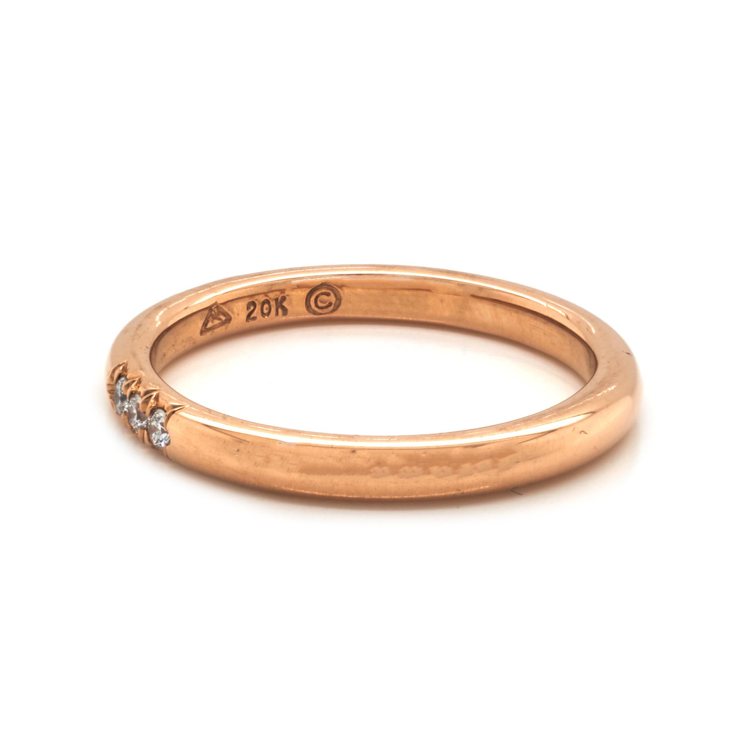Designer: Custom
Material: 20K rose gold
Diamonds: 3 round cut = .06cttw
Color: G
Clarity: VS1
Size: 5.25
Dimensions: ring measures 2.27mm in width
Weight: 3.25 grams