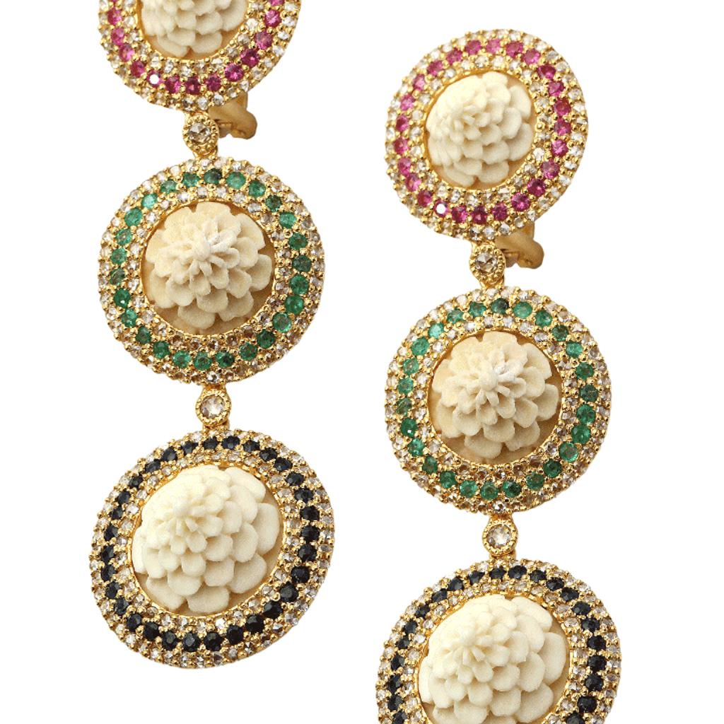 Spectacular hand-carved bone earrings set in 20 Karat Yellow Gold with Ruby weighing approximately 0.85 carats and Emerald at 0.75 carats. Sapphire 1.21 carats and rose-cut diamonds surrounding it weighing at 2.66 carats. Brought to you from Coomi's