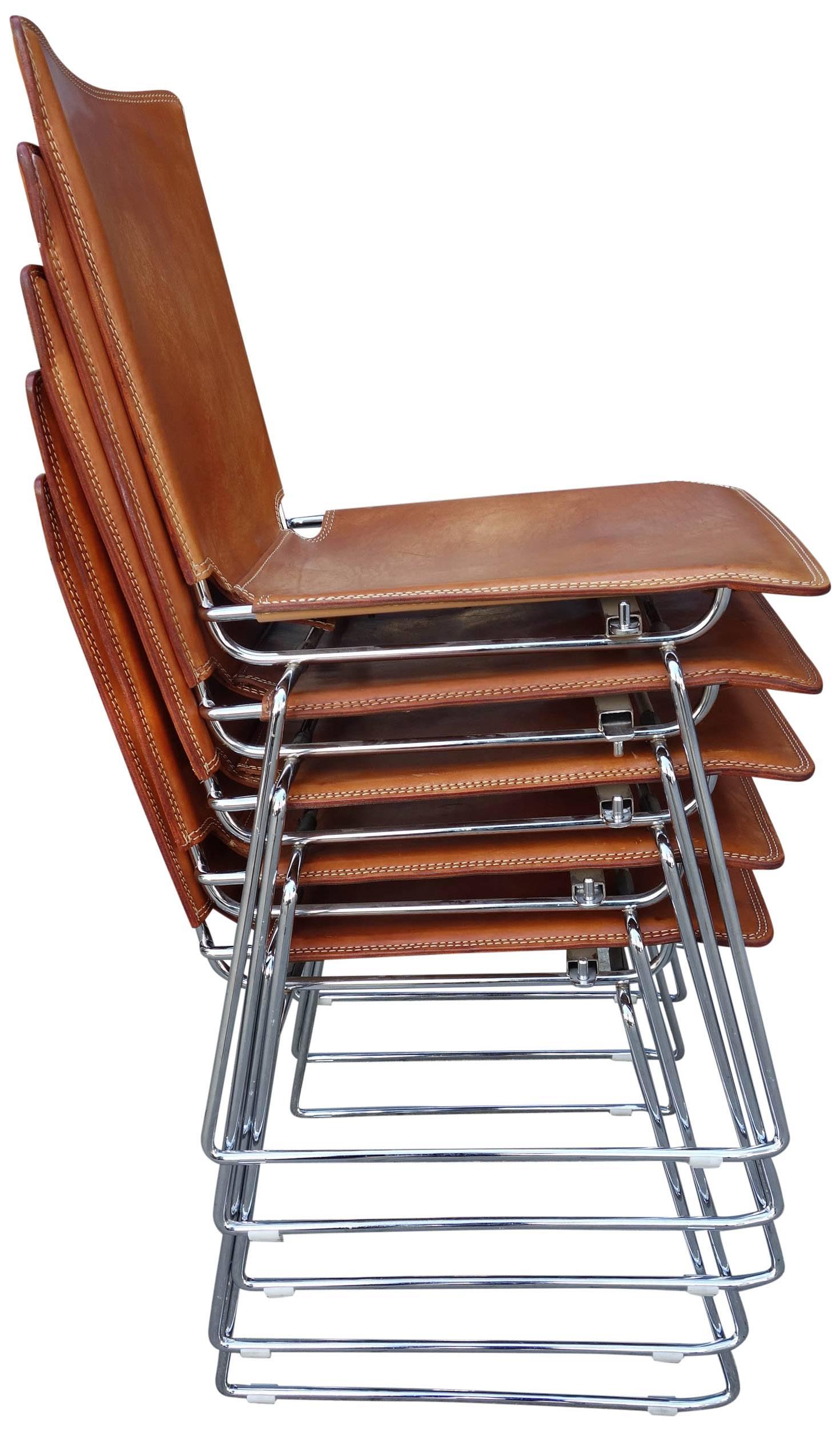 Incredible set of 20 stackable chairs by ICF. Designed by Toyoda Hiroyuki. Thick tanned saddle leather covering a heavily chromed base. Wonderful details of stitched and laced leather. These can easily be stacked in groups of 5 or ganged together by
