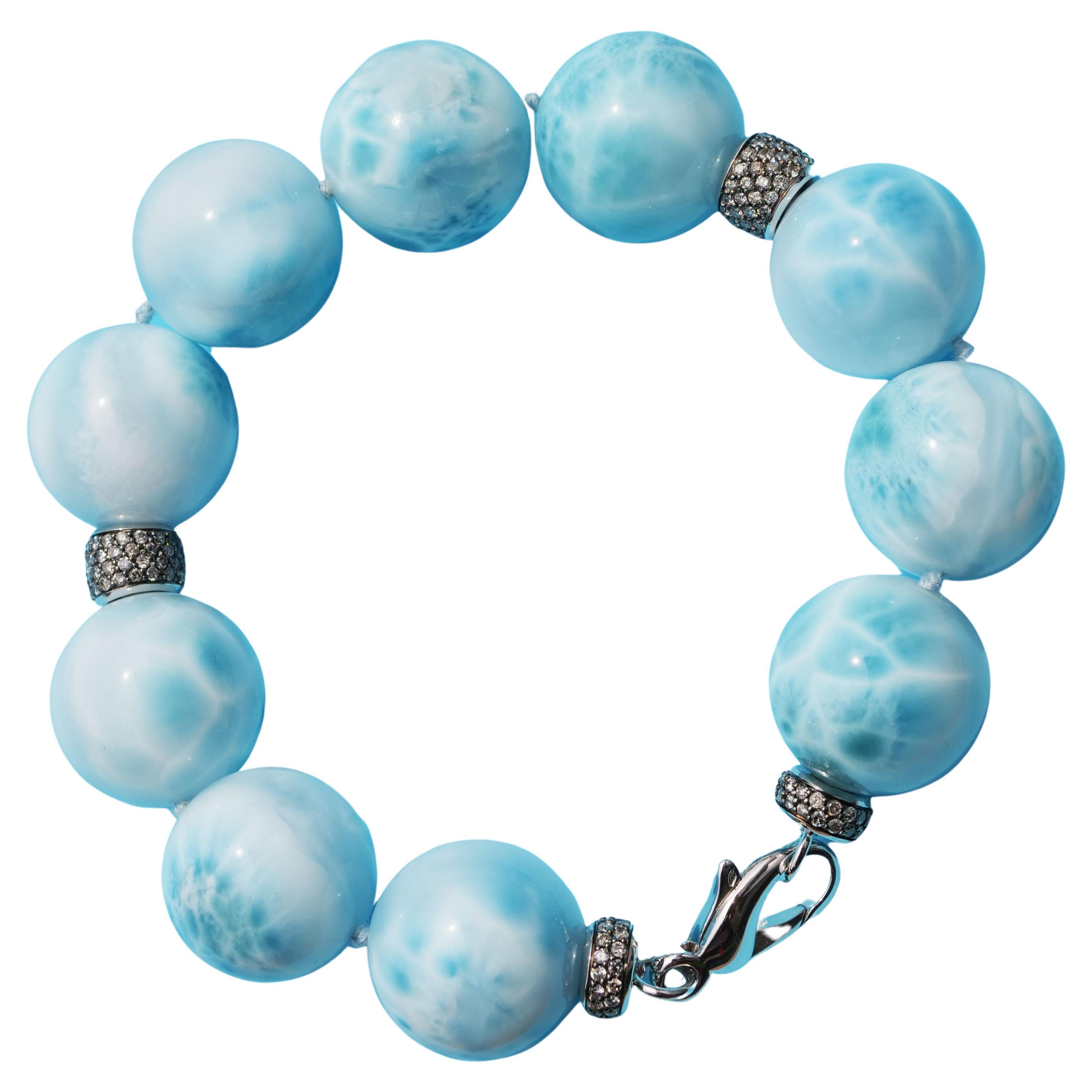 this cloudy beauty comes from the Dominican Republic and is called Larimar 20 mm balls necklace in top quality, wonderful pattern distribution, processed in our traditional goldsmith in Valenza in 750 white gold with gray full-cut brilliant-cut