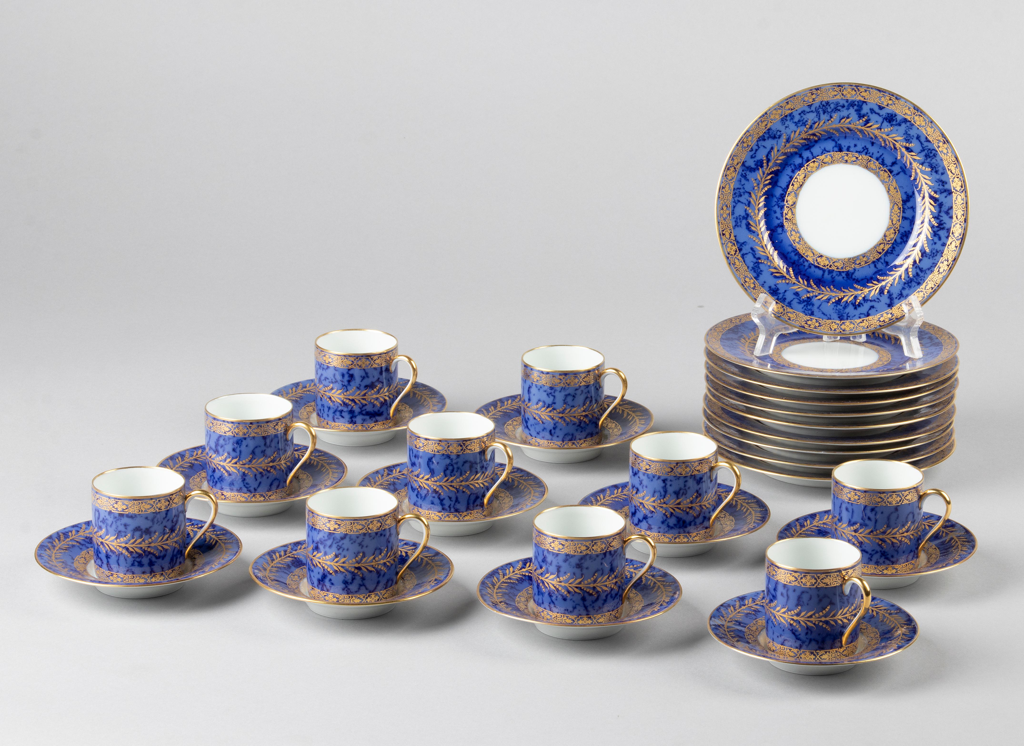 Great set of porcelain coffee and pastry service from the French brand Raynaud Limoges. The service has a beautiful deep blue color, with a bit of a cloudy pattern and beautiful gold accents. The service dates from around 1970-1980. All parts are