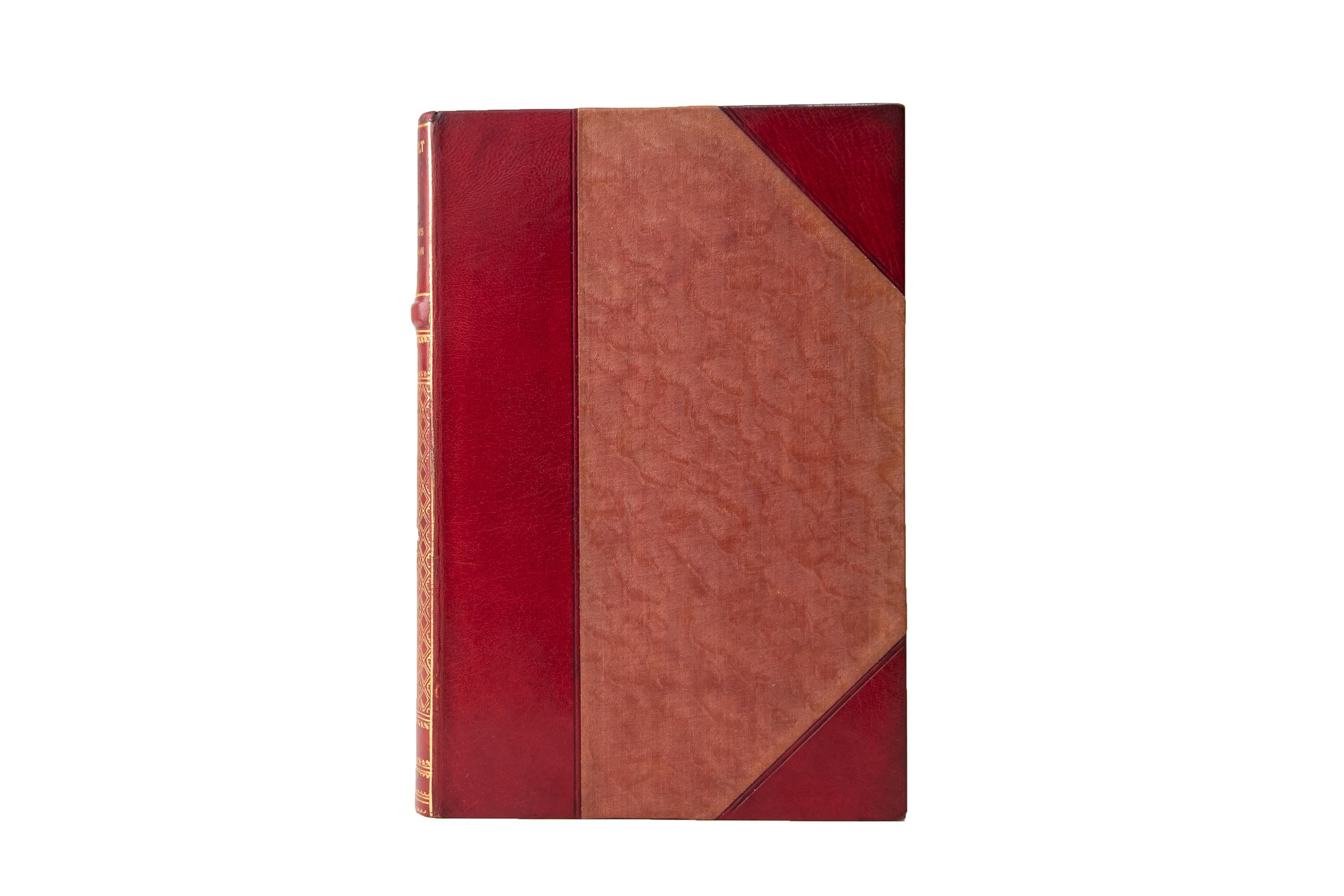20 Volumes. Theodore Roosevelt, The Works. National Edition. Bound in 3/4 red morocco and silk boards. The spines display raised bands intricate floral and elephant panel details, bordering, and label lettering, all gilt-tooled. The top edges are