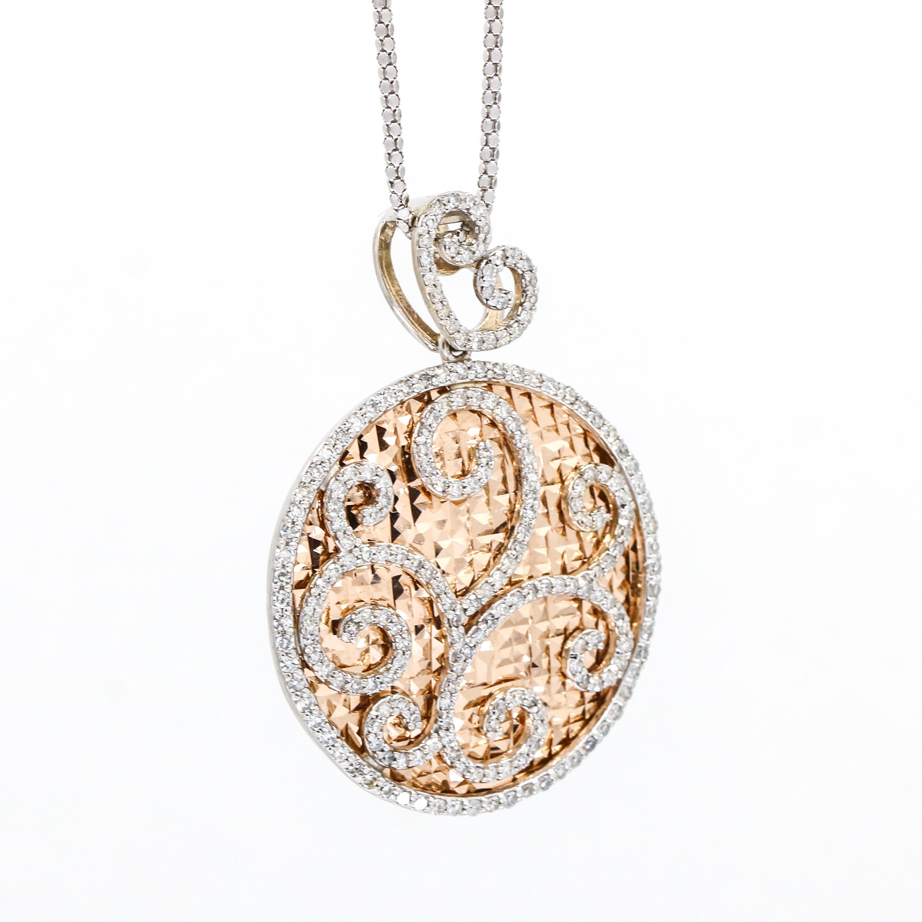 Round disk pendant with rose gold diamond cut background, white gold swirl details, and heart shaped bale pave set with diamonds. The pendant comes with a 14-karat white gold chain. 

Length, 16.5 inches
Diameter, 33mm
Depth, 7mm
Weight, 18.2