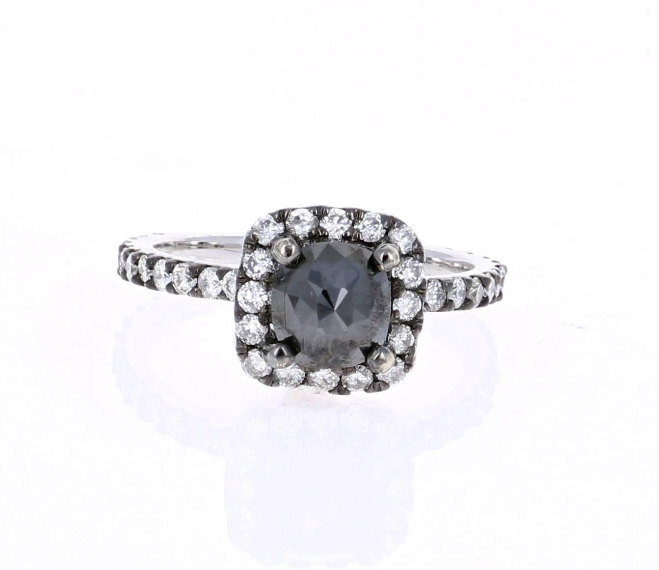 A cute and dainty Black and White Diamond Ring in a Black Rhodium finish for a Vintage-inspired look that can be that special someone's Engagement Ring. This ring has a 1.37 carat Black Diamond in the center of the ring which is surrounded by 38