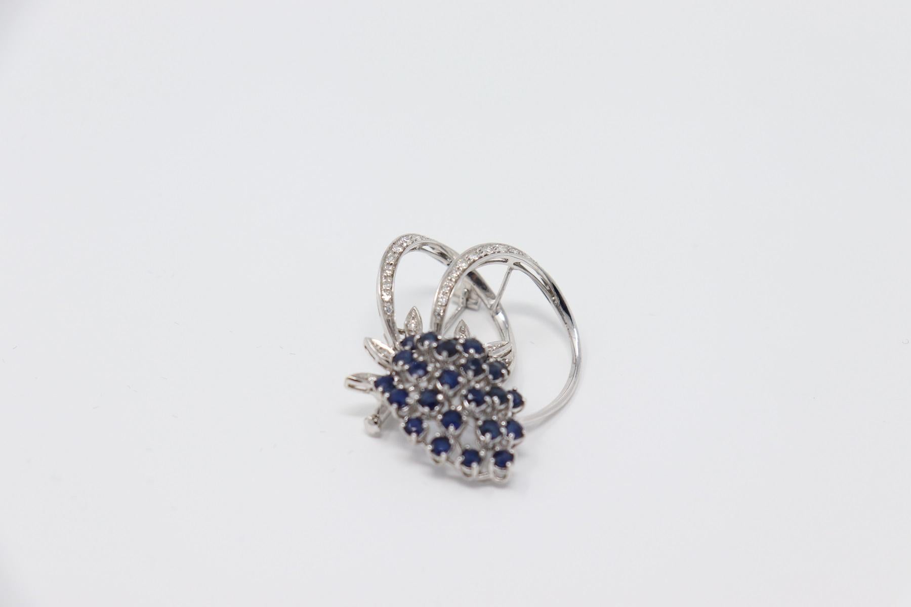 white gold fashion brooche with about 2.00 carat Blue Sapphires and 0.3 Carat diamonds. Perfect for an elegant and refined woman.
Total weight: about 13,50 g.
New contemporary jewelry. Produced in the famous Italian city of gold Valenza. 
This