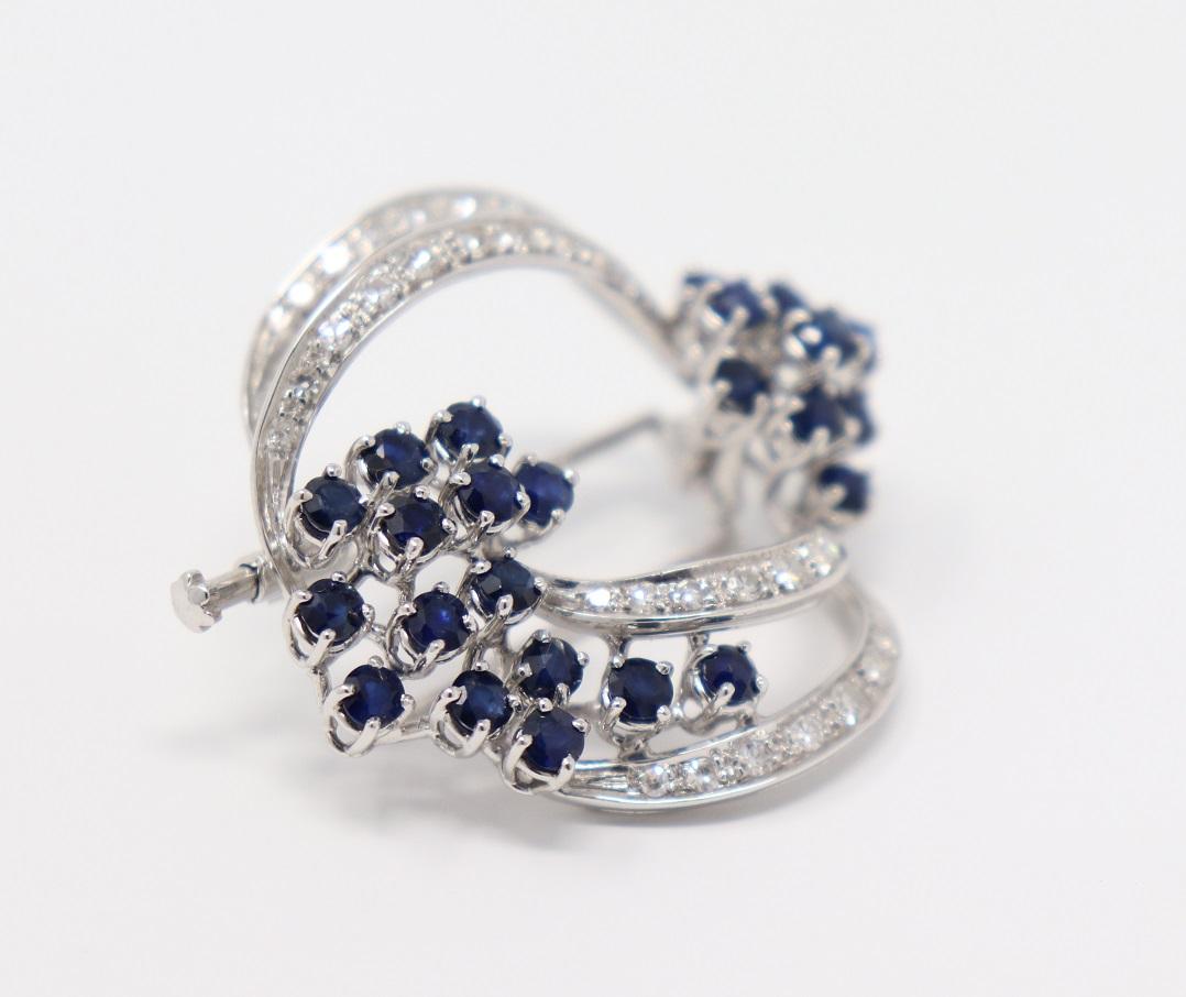 white gold fashion brooche with about 2.00 carat Blue Sapphires and 0.45 Carat diamonds. Perfect for an elegant and refined woman.
Total weight: about 10,60 g.
New contemporary jewelry. Produced in the famous Italian city of gold Valenza. 
This