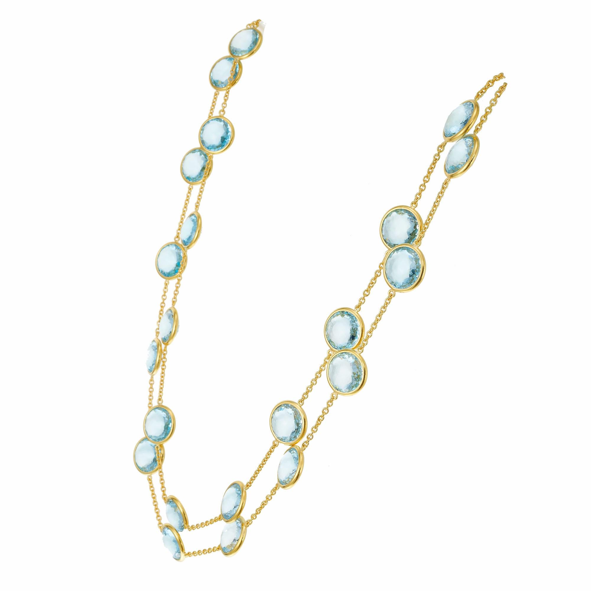 Topaz station necklace. 29 double faceted cabochon bezel set blue topaz double sided, by the yard necklace. 18k yellow gold with a toggle catch. Can be worn long or doubled. 40 inches long. 

29 round double faceted cabochon blue topaz, VS approx.