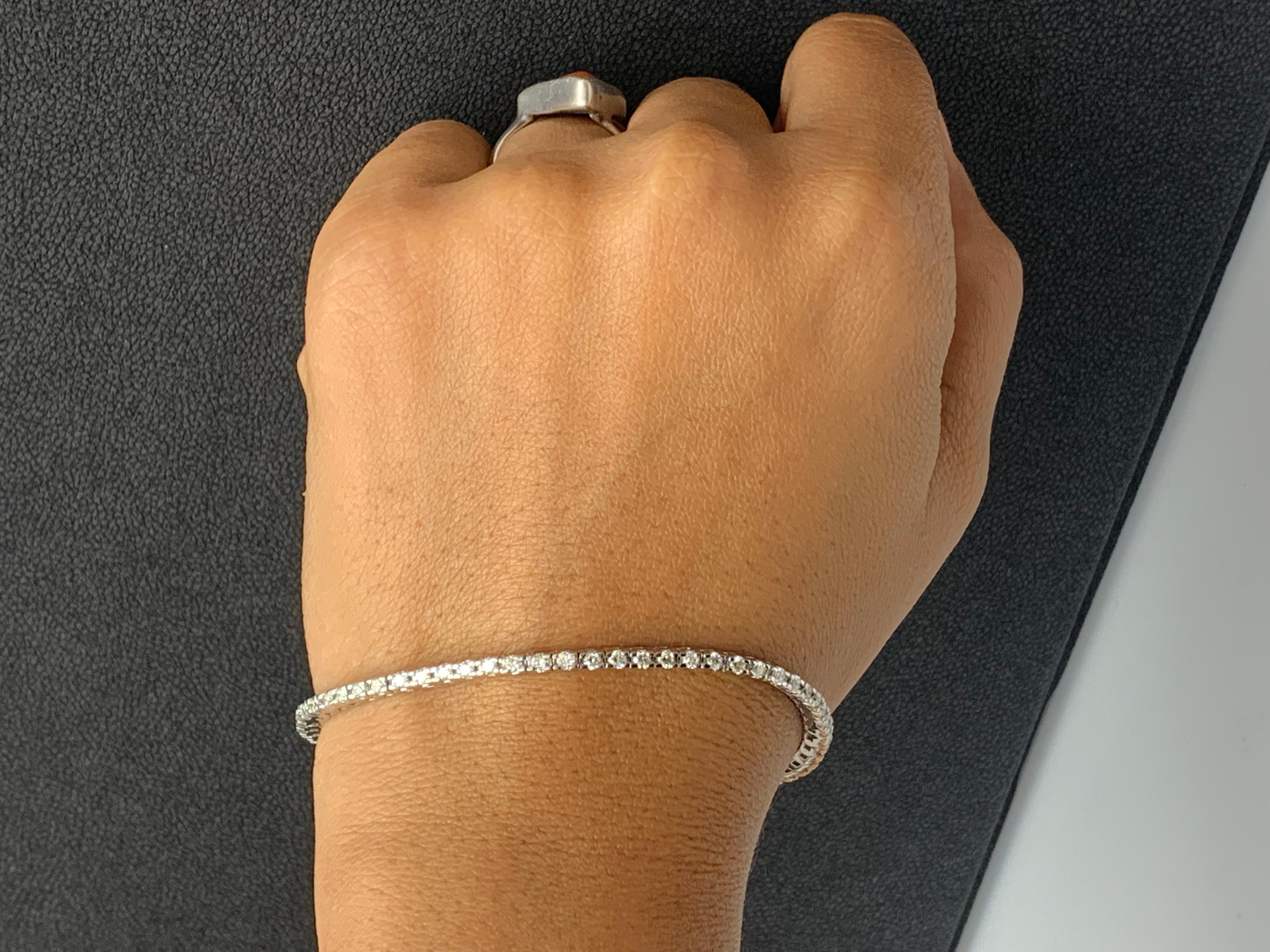 A classic tennis bracelet style showcasing a row of round brilliant diamonds, set in a polished 14k white gold mounting. 62 Diamonds weigh 2.00 carats total and are approximately GH color, SI1 clarity.

Style available in different price ranges.
