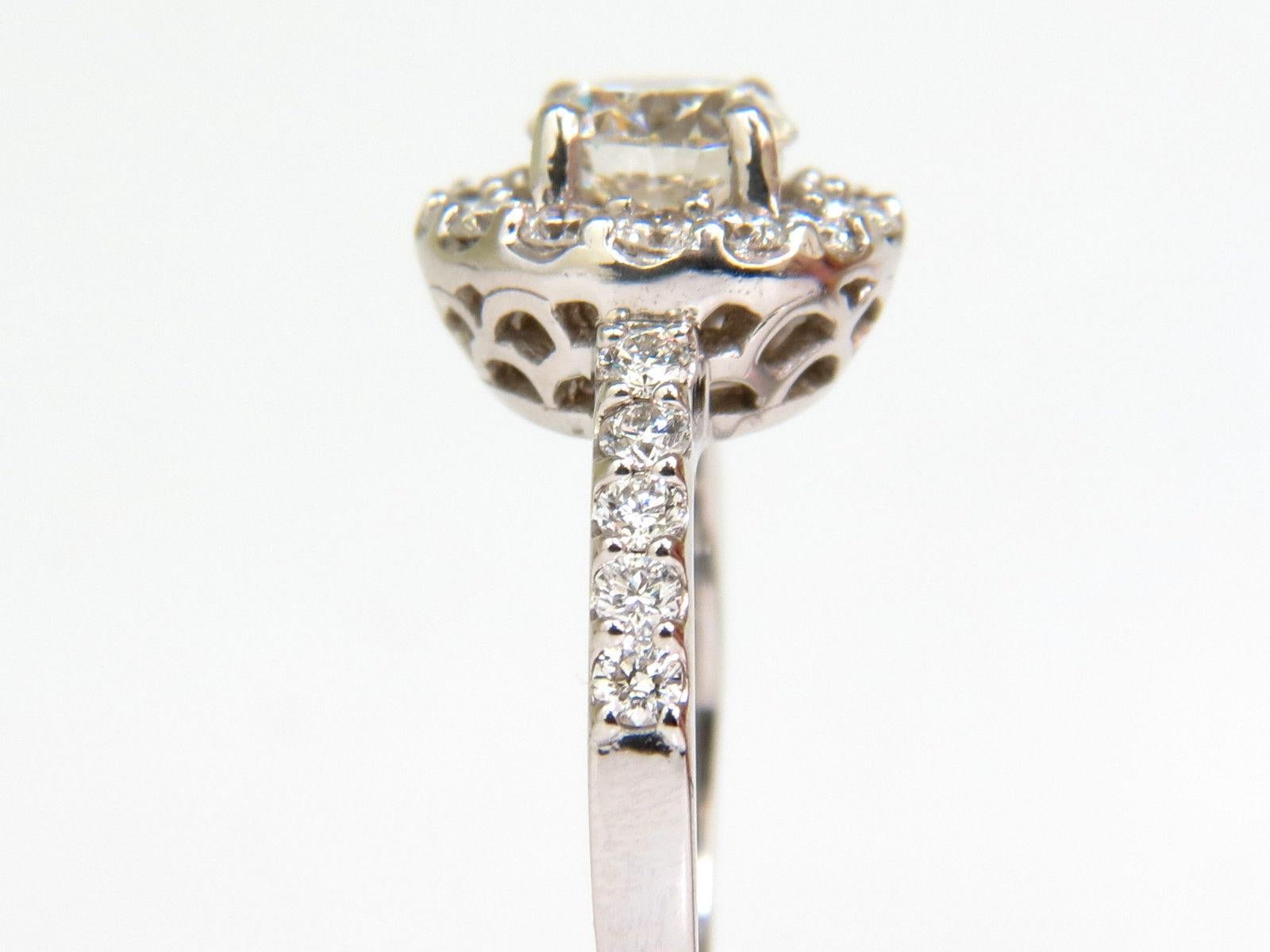 1.00ct. Center round diamond ring

6.4mm diameter

Excellent cut

J-color & Si-1 Clarity



Side round Diamonds: 

1.00ct.

Full Brilliant cuts

H Color

Vs-2 clarity.

14kt. white gold.

5.1 Grams.

Ring is 11.5mm wide

Depth: 7.6mm

Current size: