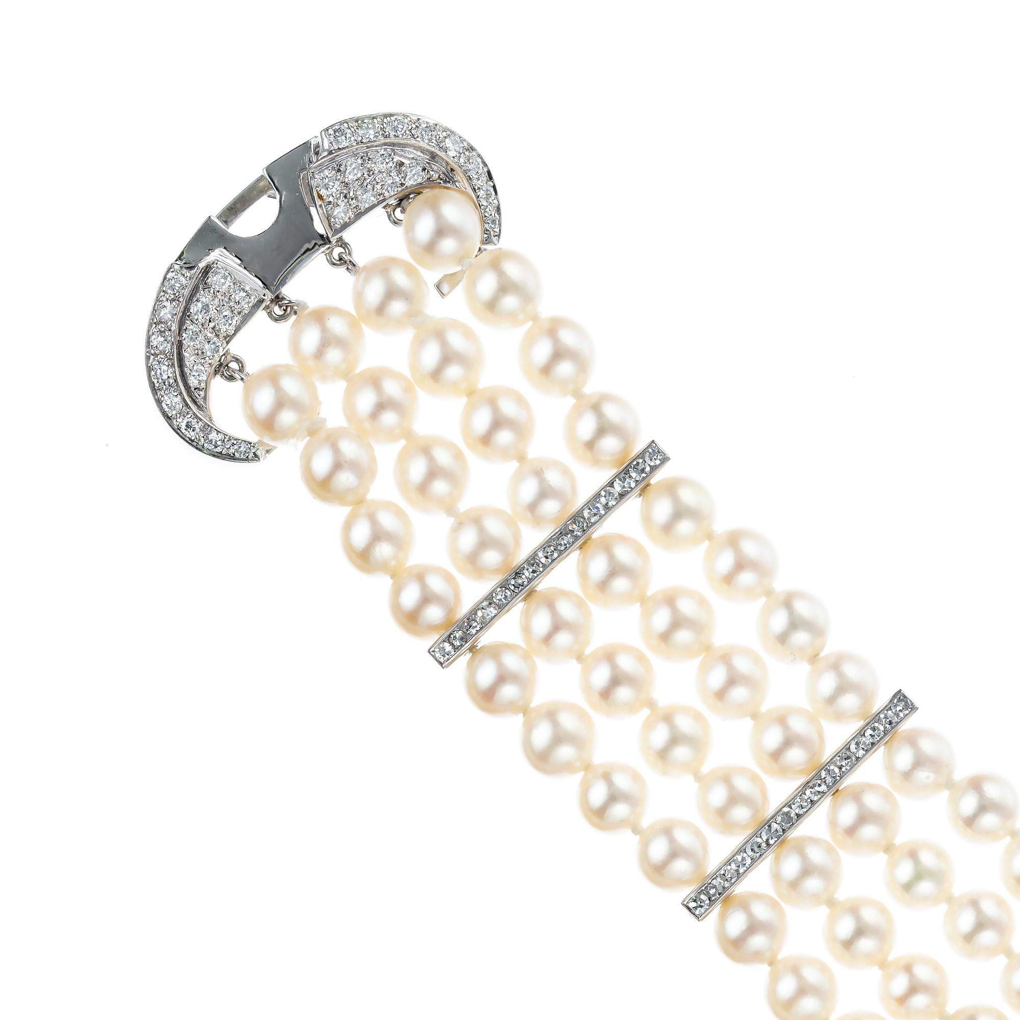 Mid-Century 1960's four row cultured pearl and diamond bracelet. 100 Akoya cream color high lustre pearls ranging in size 5.5 to 6mm in 4 rows with 14k white gold separators accented with round diamonds also along the clasp and catch. 7 inches in