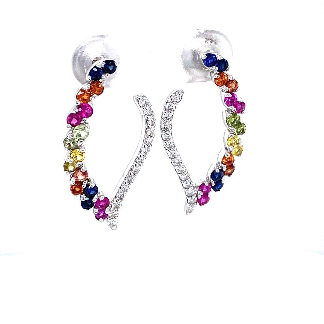 2.00 Carat Diamond and Multi Color Sapphire White Gold Earrings

These stunning earrings have a combination of diamonds and sapphires sparkling around each other.  There are 28 Round Cut Diamonds that weigh 0.42 Carats (Clarity: SI, Color: F),  28