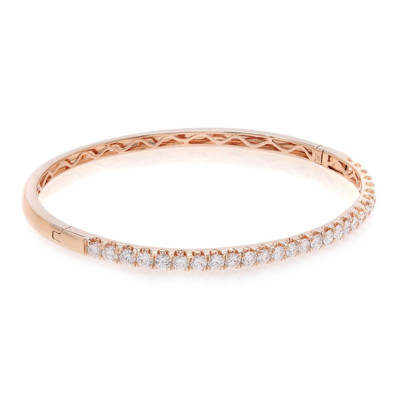 Introducing the versatile and elegant diamond bangle, a true embodiment of modern sophistication. Crafted with precision, this chic piece showcases over two carats of brilliant round diamonds, delicately pavé set in 18k rose gold. The stunning