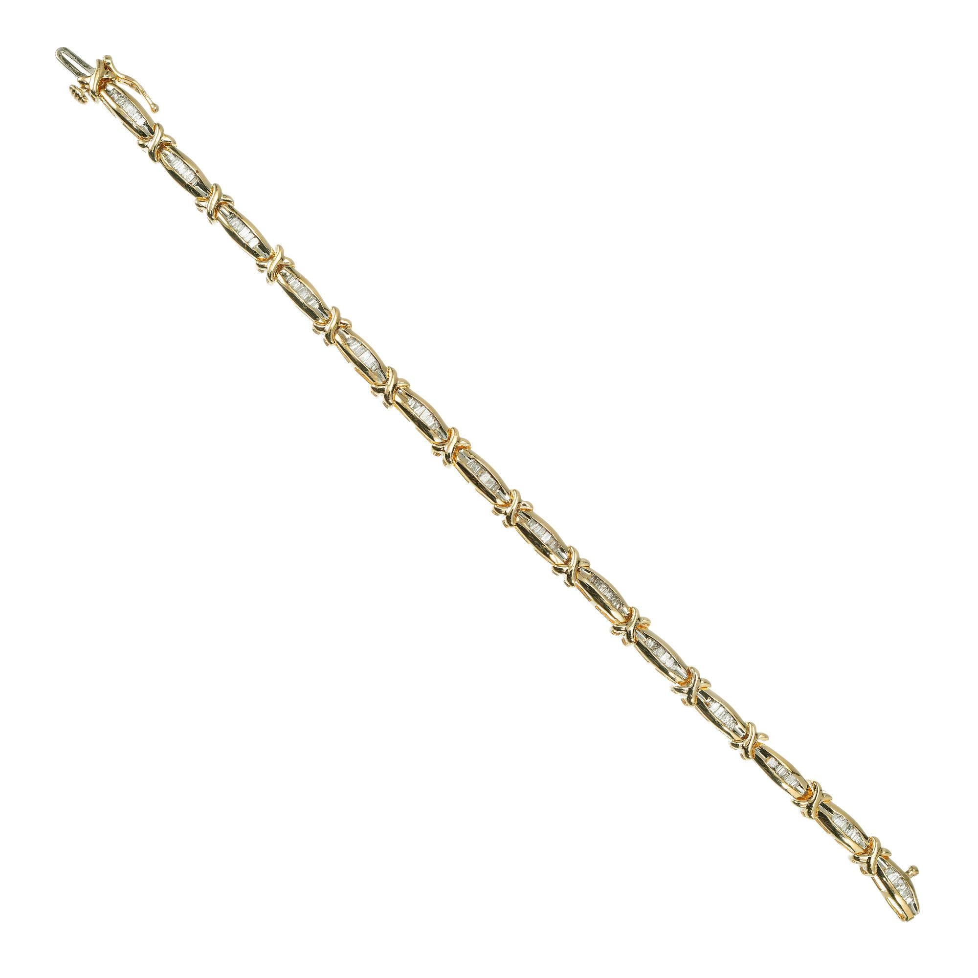 Diamond hinged link 14k yellow gold bracelet with 98 channel set baguette diamonds. 6.75 inches in length.

98 baguette cut diamonds approx. total weight 2.00cts, I - J, SI
14k Yellow Gold
Stamped: 14k
11.1 grams
Height: 4.2mm
Width: 4.8mm
Length: 6
