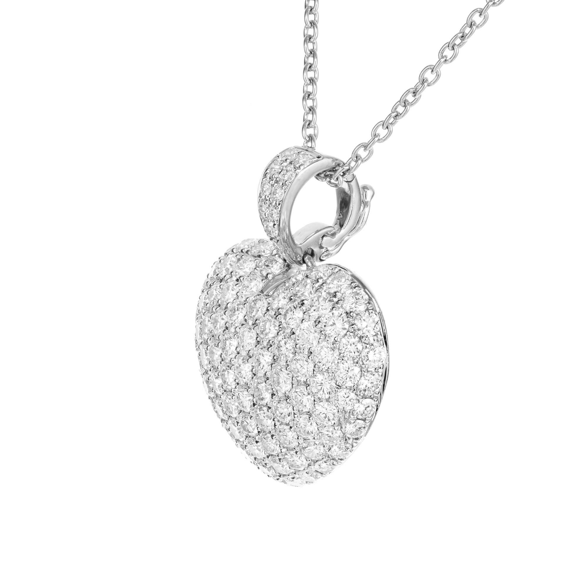 Puffed pave diamond heart pendant necklace. 100 round brilliant cut pave diamonds, set in a platinum domed heart shaped setting. 16 inch platinum chain. 
100 round brilliant cut diamonds, F-G VS approx. 2.00cts
Platinum 
Stamped: PT950
7.4 grams
Top