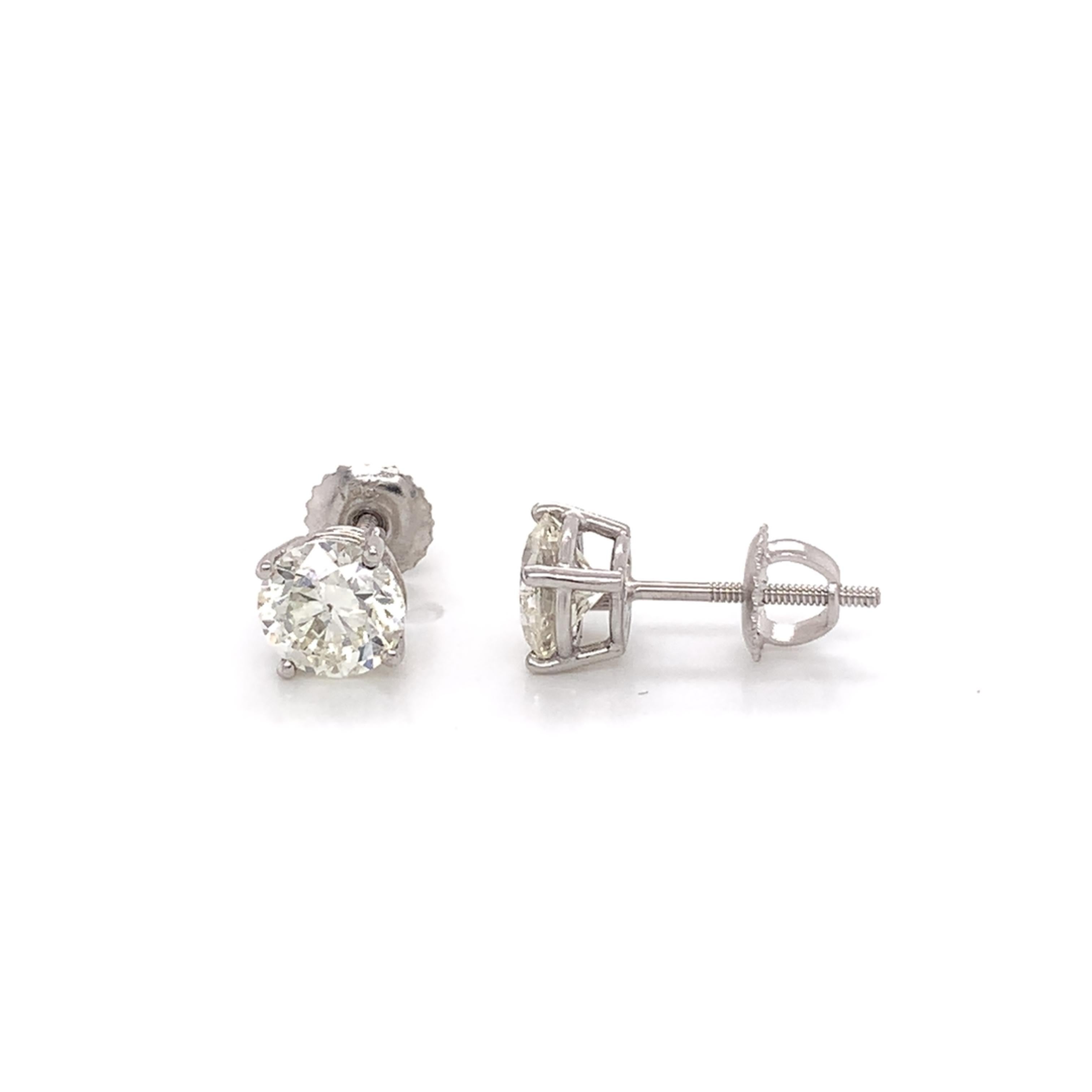 EGL Certified diamond stud earrings made with real/natural brilliant cut diamonds. Total Diamond Weight: 2.18 carats. Diamond Quantity: 2 round diamonds. Color: G-H. Clarity: SI2-SI3. Mounted on 18 karat white gold screw back setting.