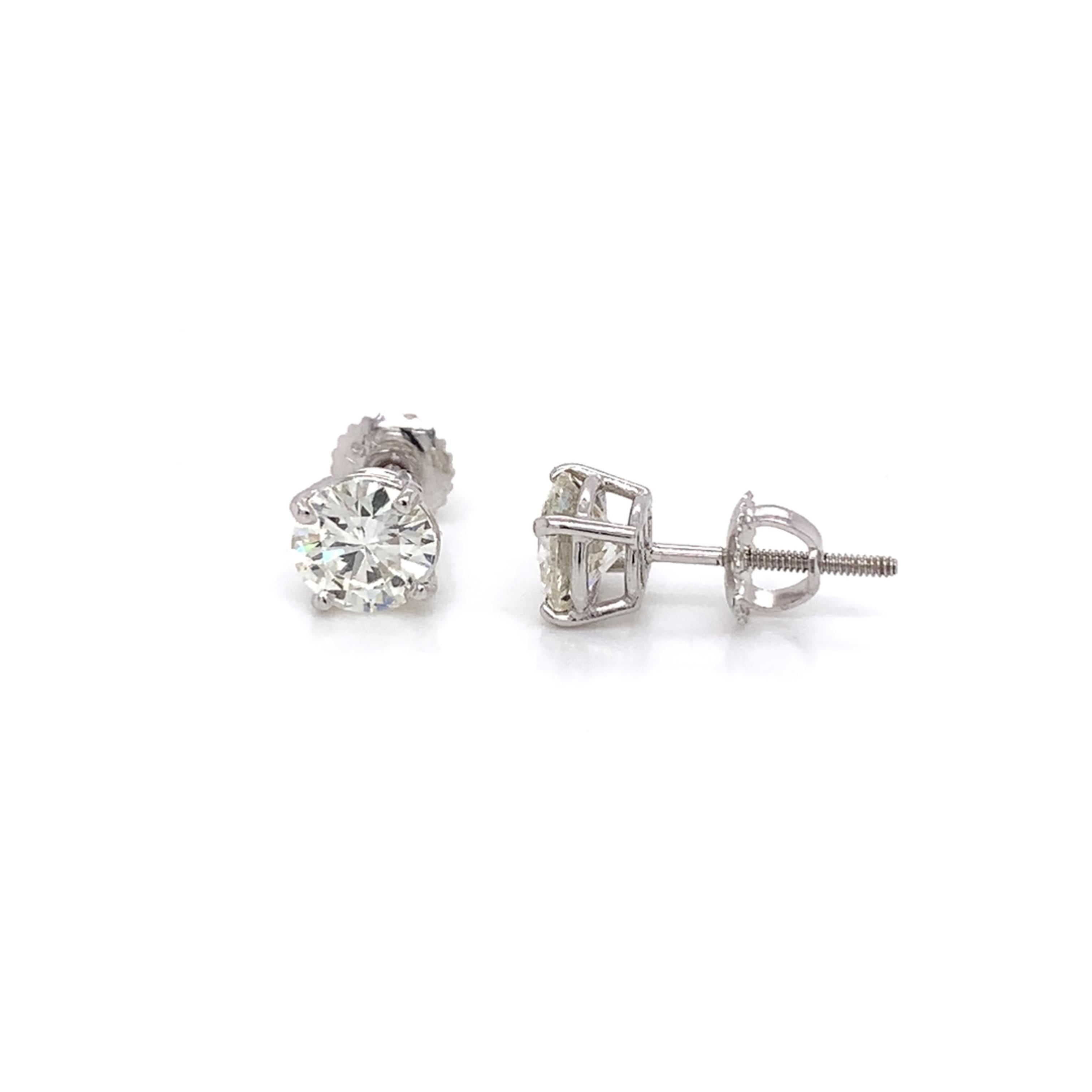 Diamond Stud Earrings made with real/natural brilliant cut diamonds. Total Diamond Weight: 2.02cts. Diamond Quantity: 2 round diamonds. Color: J-K. Clarity: VS. Mounted on 18 karat white gold screw back setting.