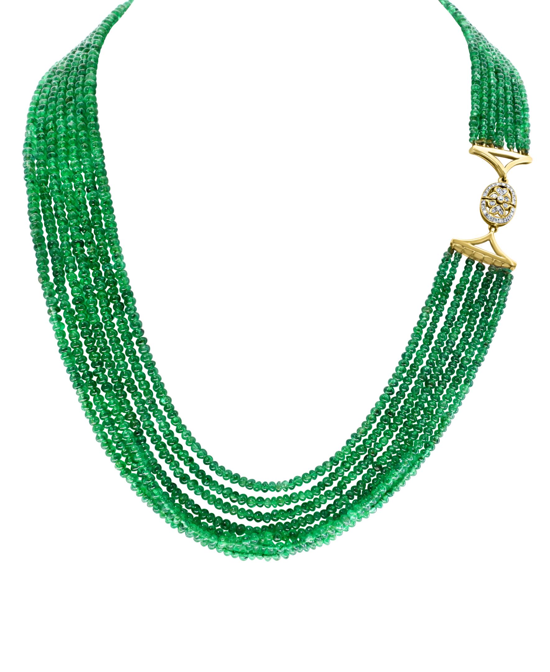 200 Carat  Emerald Beads 7 Line  Necklace With Diamond Clasp 18 Kt Yellow Gold 
This spectacular Necklace   consisting of approximately 200 Ct  of fine beads.
 There are 7 rows of fine Emerald Beads  
Total carat weight of diamonds  is 0.6 Ct,