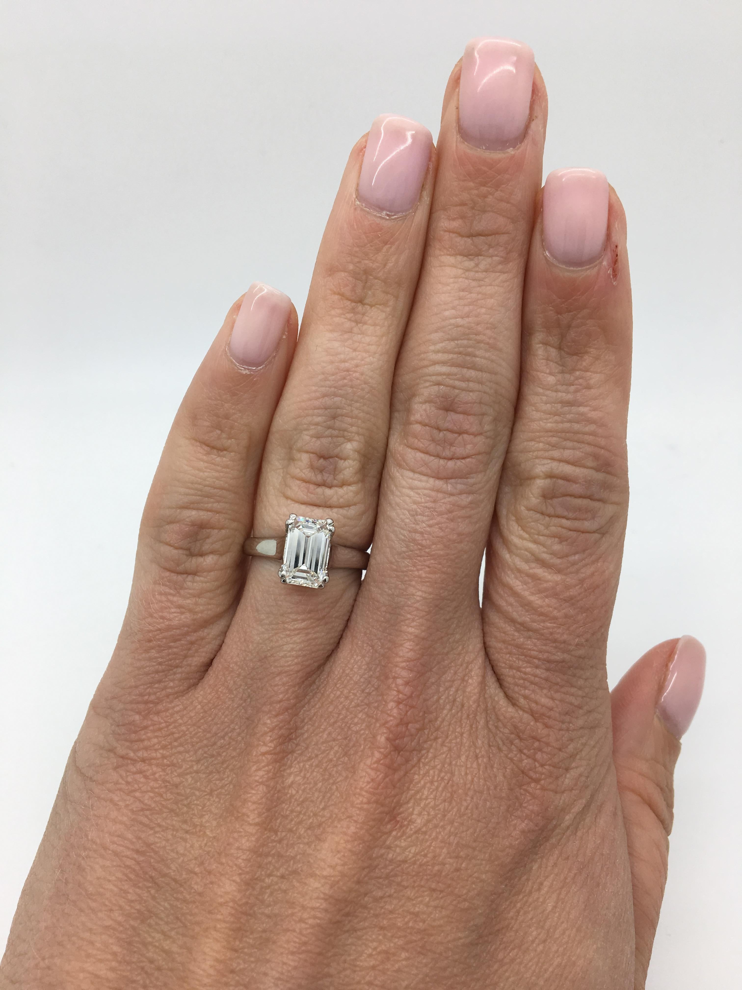 Timeless 2.00CT Emerald Cut Diamond Solitaire engagement ring with double prongs. 

Diamond Carat Weight: 2.00CT
Diamond Cut: Emerald Cut
Diamond Color: I-J 
Diamond Clarity:  SI2
Metal: Platinum
Ring Size: 5.5
Marked/Tested: Stamped 