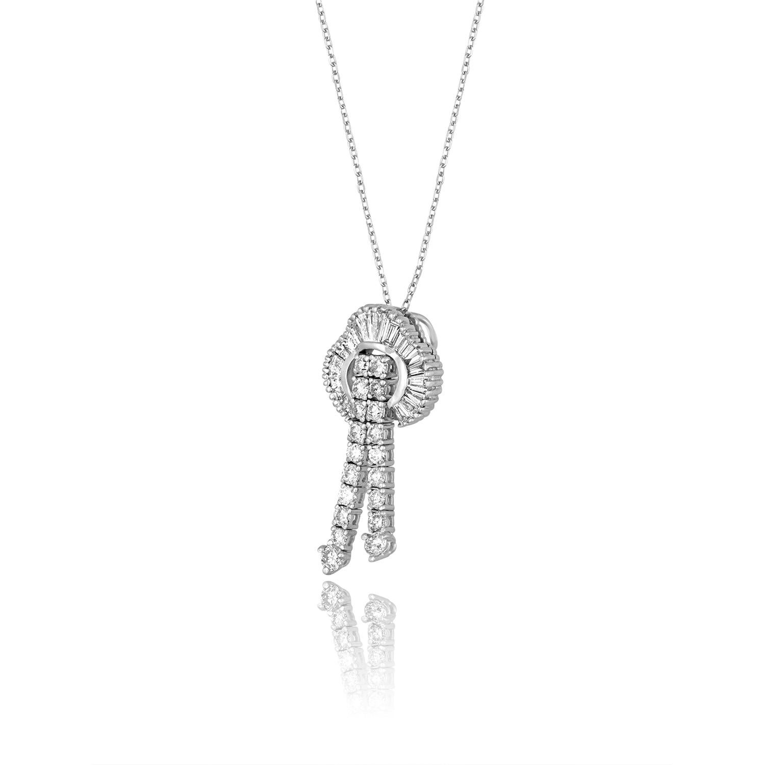 The pendant & chain is 14K White Gold.
The pendant has 2.00 Carats in Diamonds H VS/SI
There are round and baguette diamonds
The pendant measures 1