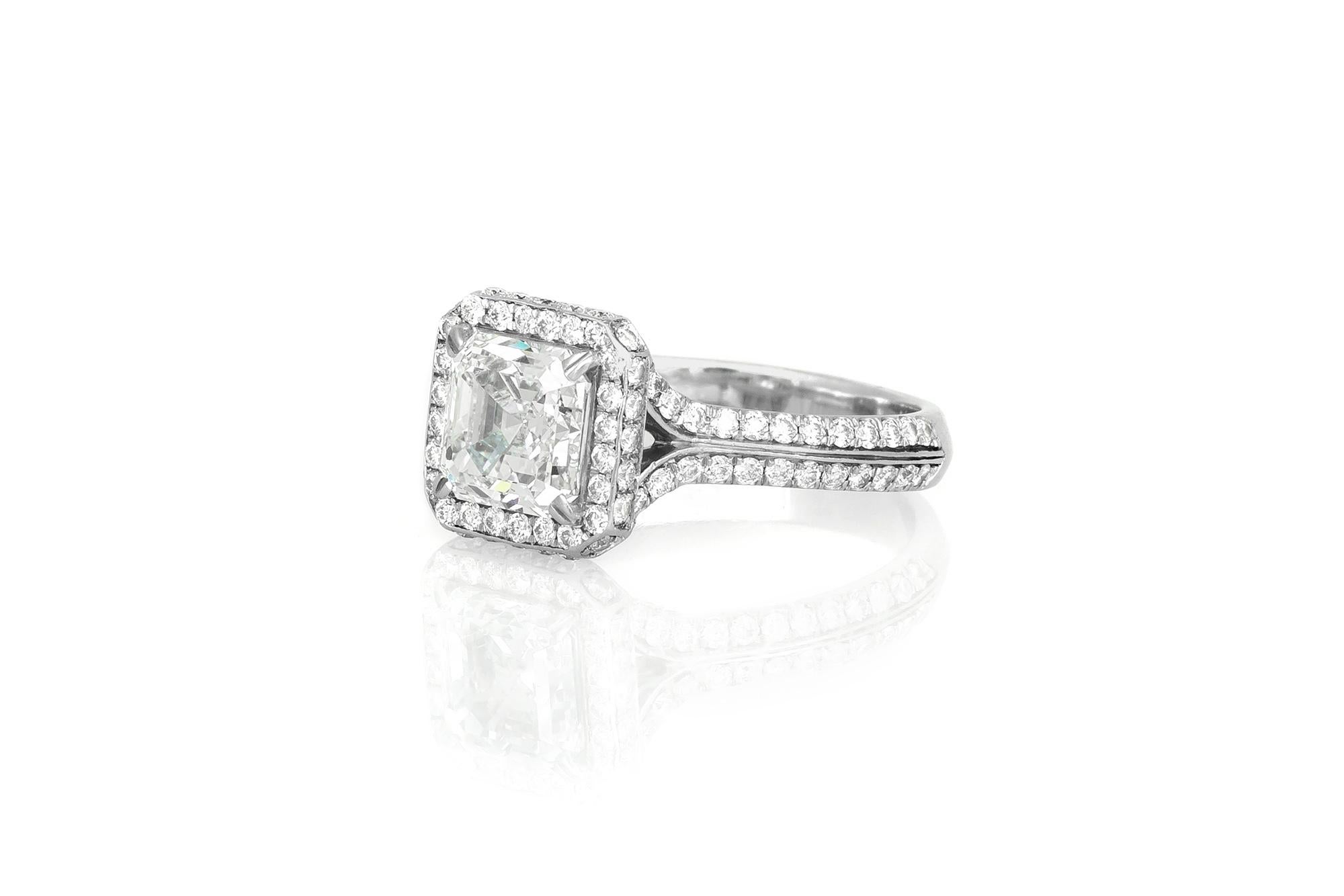 Finely crafted in platinum, with a center GIA certified Square Emerald cut diamond, weighing 2.00 carats.
Color G Clarity VS2. 
The ring is accented with micro-pave brilliant cut diamonds.