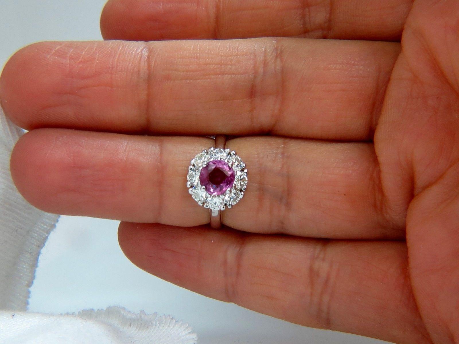 1.20ct. Natural Pink Sapphire diamonds ring.

Full cut brilliant round

 supreme Clean clarity 

Transparent and vibrant top Bright gem Gem Fancy Intense pink color

6.4mm diameter



.80ct. Diamonds 

  rounds, full cut 

F/G-color vs-2
