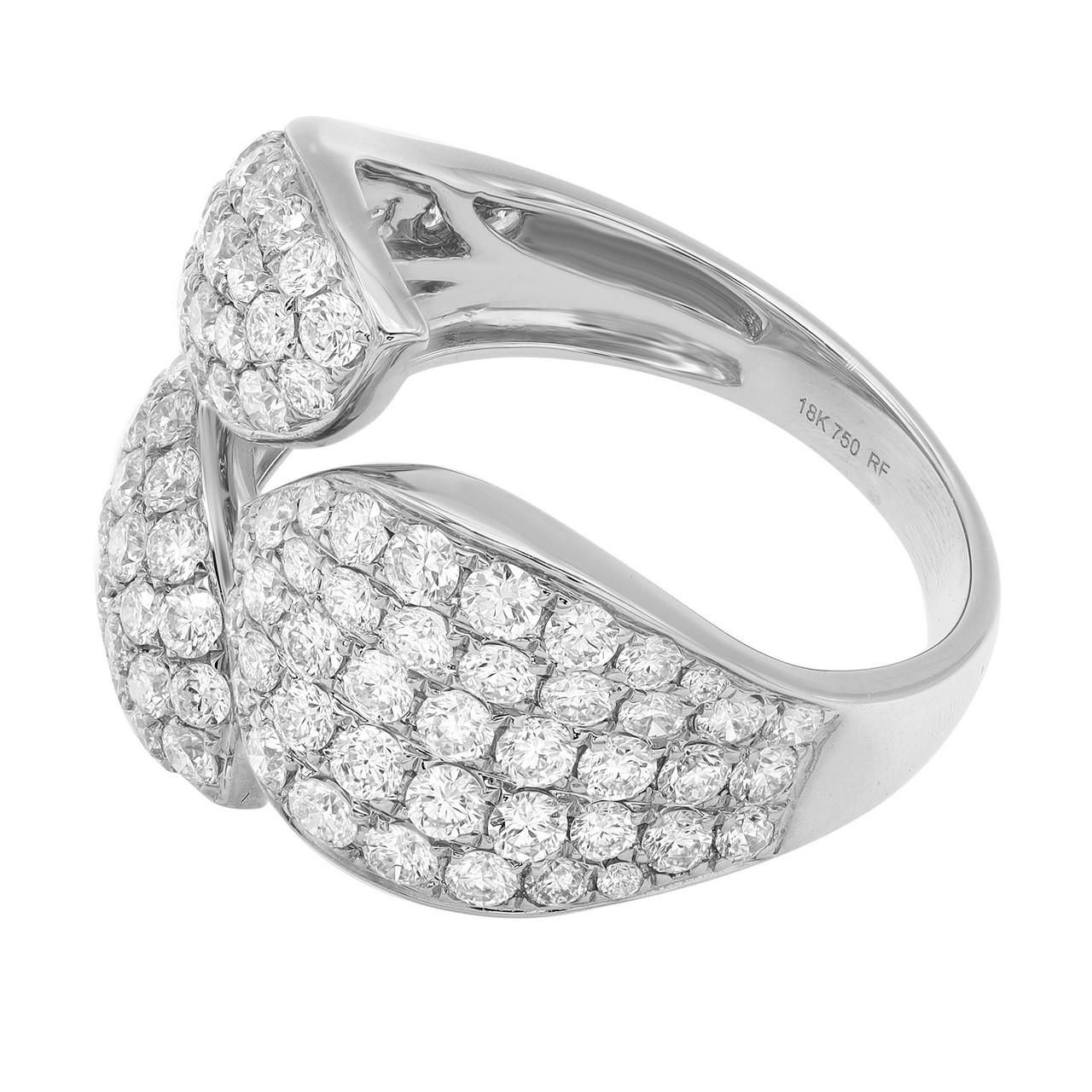 Indulge in the captivating allure of the 2.00 Carat Pave Set Round Cut Diamond Ring in 18K White Gold. The mesmerizing bypass design gracefully wraps around your finger, creating a visual symphony of brilliance. The ring boasts a magnificent array