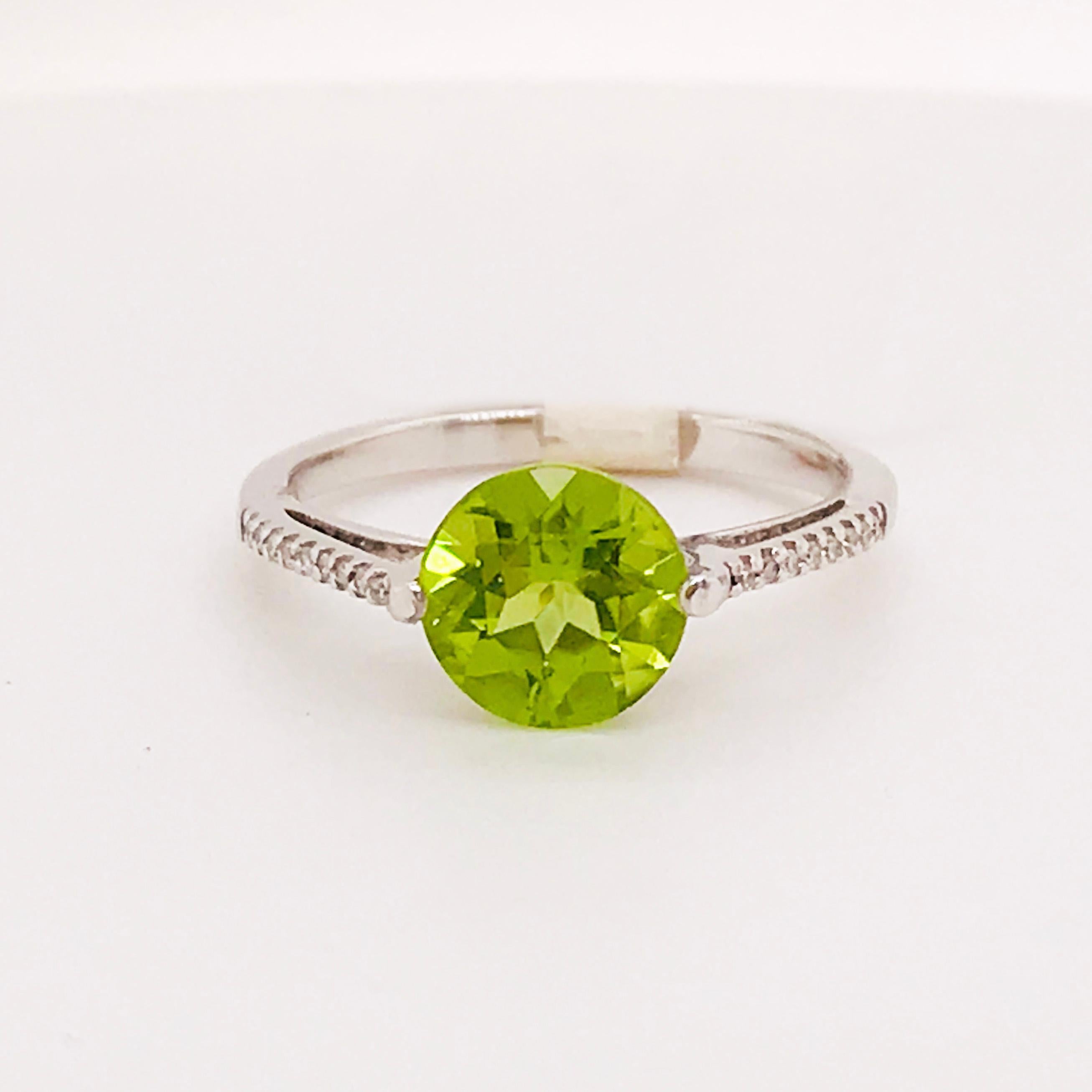 This is a beautiful peridot and diamond ring. With a genuine peridot gemstone set in the center, this peridot has been cut in a round brilliant shape that's been faceted to show the maximum brilliance in the gemstone. The band has round brilliant