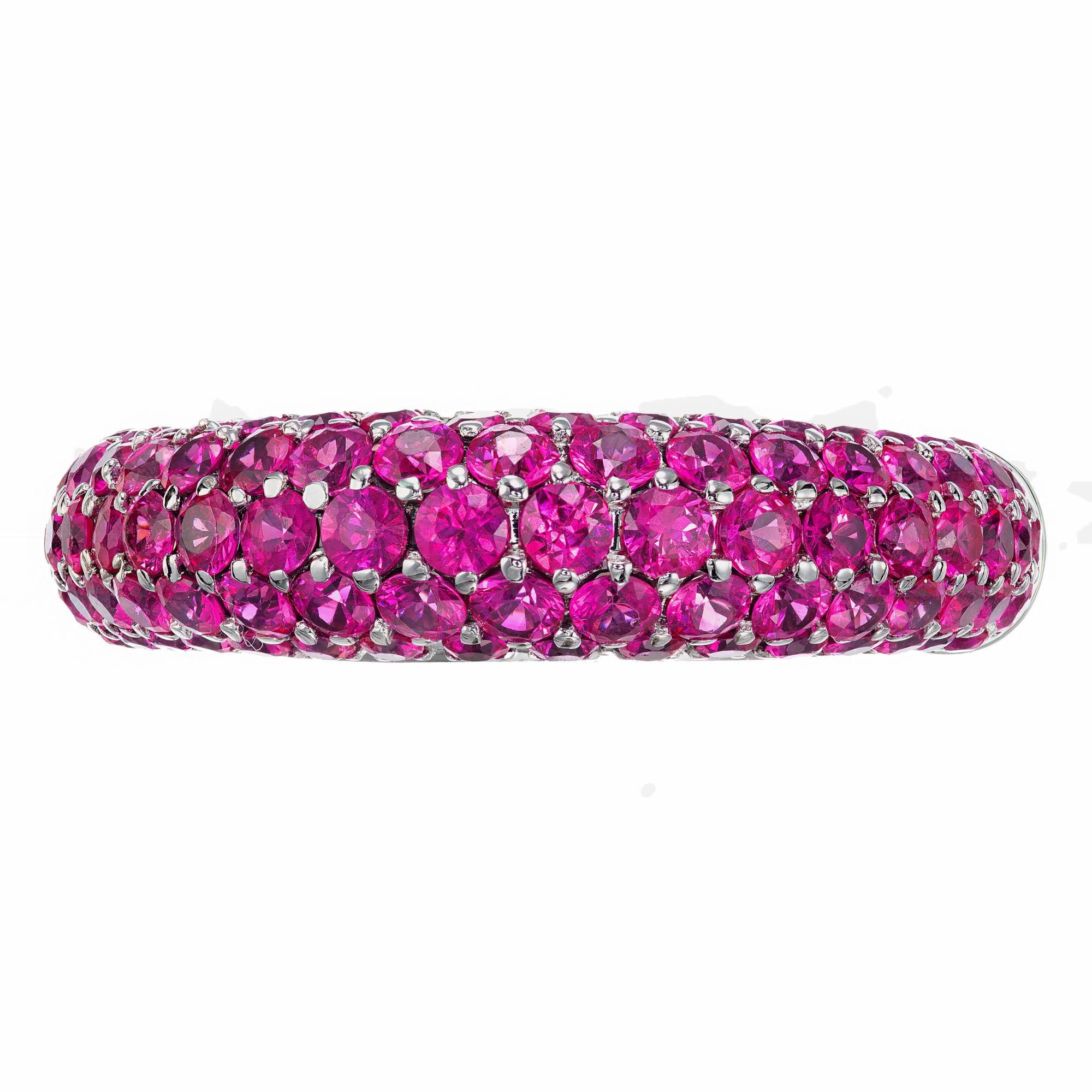 Domed five row bright pink Sapphire cluster band ring. 84 round sapphires set in 18k white gold.

84 round pink Sapphires, approx. total weight 2.00cts, VS – SI
Size 8.5 and sizable
Tested: 18k
Stamped: 750
18k white gold
9.2 grams
