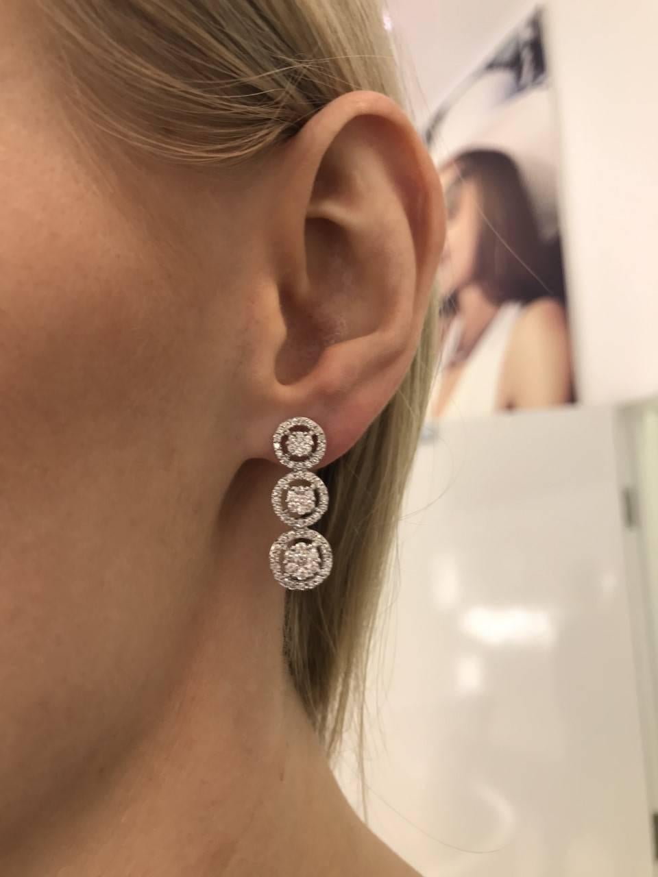 These Stunning 2.00 Carat Three Tier Cluster Drop Diamond Earrings Color H Clarity SI1 set in 18 Karat White Gold are perfect for any occasion. British Hallmarked.

Made by Hasbani Diamonds London. We believe in creating your own unique look by