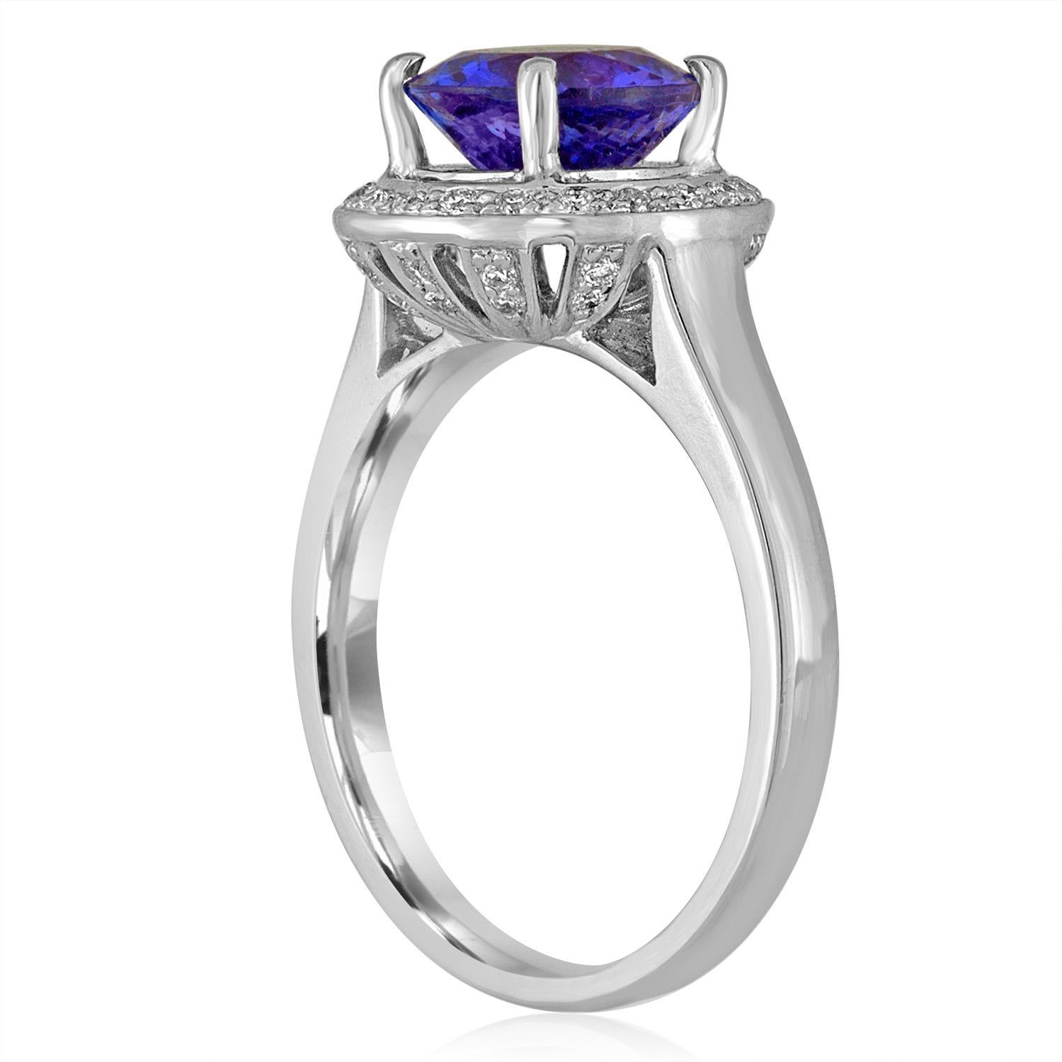 Stunning & Unusual Engagement Round Halo Ring
The ring is 18K White Gold.
The ring has 0.35 Carts in Diamonds F/G VS/SI
The center Stone is a Round Tanzanite 2.00 Carat
The ring is a size 6, sizable.
The ring weighs 5.5 grams