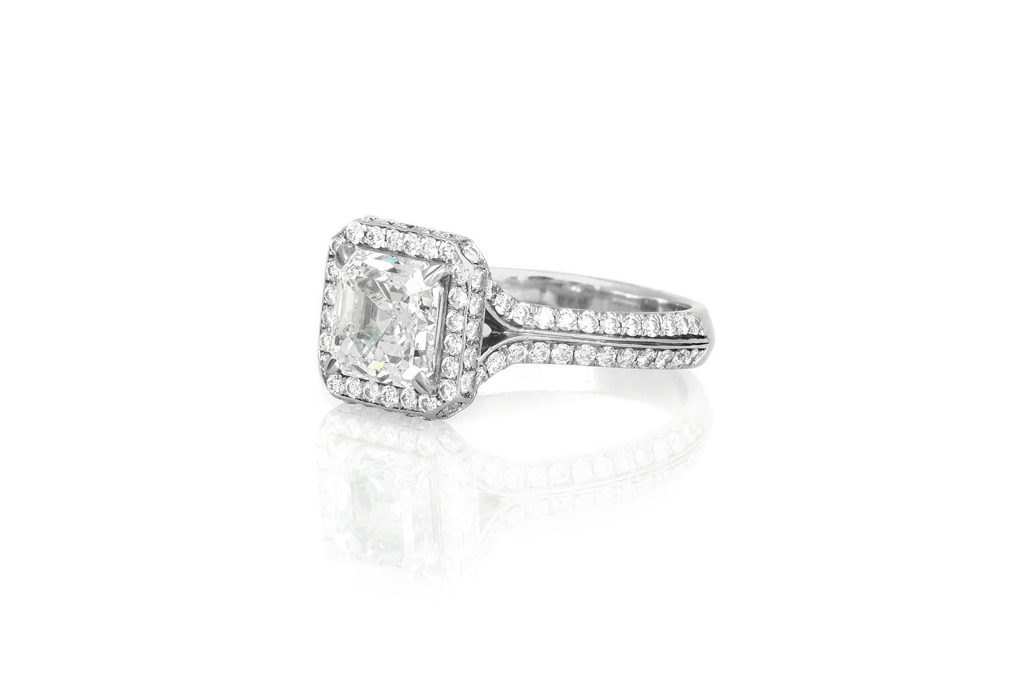 Finely crafted in platinum with a center GIA certified Square Emerald cut Diamond weighing 2.00 carats, G color, VS2 clarity, GIA#1172403747, and pave set Round Brilliant cut Diamonds weighing a total of approximately 1.00 carat.
Size 6 3/4,