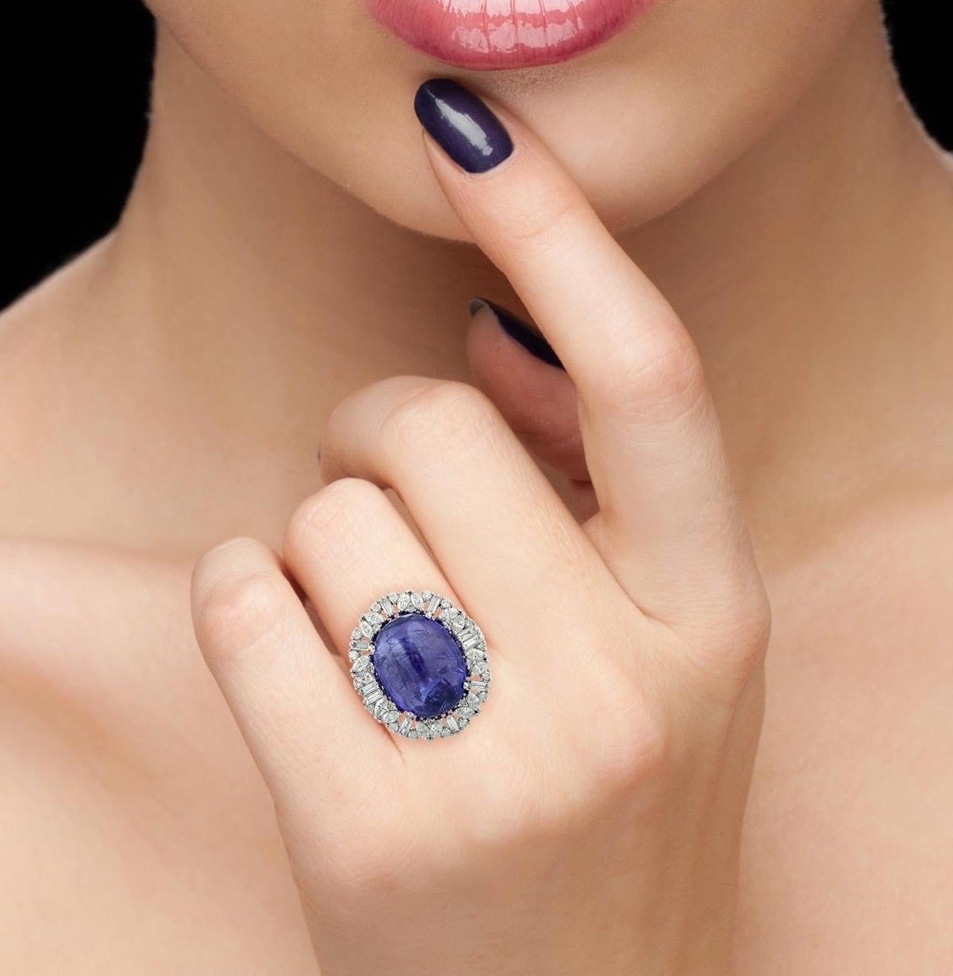 This stunning ring has been meticulously crafted from 14-karat white gold. It is centered with 20.0 carats tanzanite, illuminated with 1.77 carats of glittering diamonds. 

The ring is a size 7 and may be resized to larger or smaller upon request.