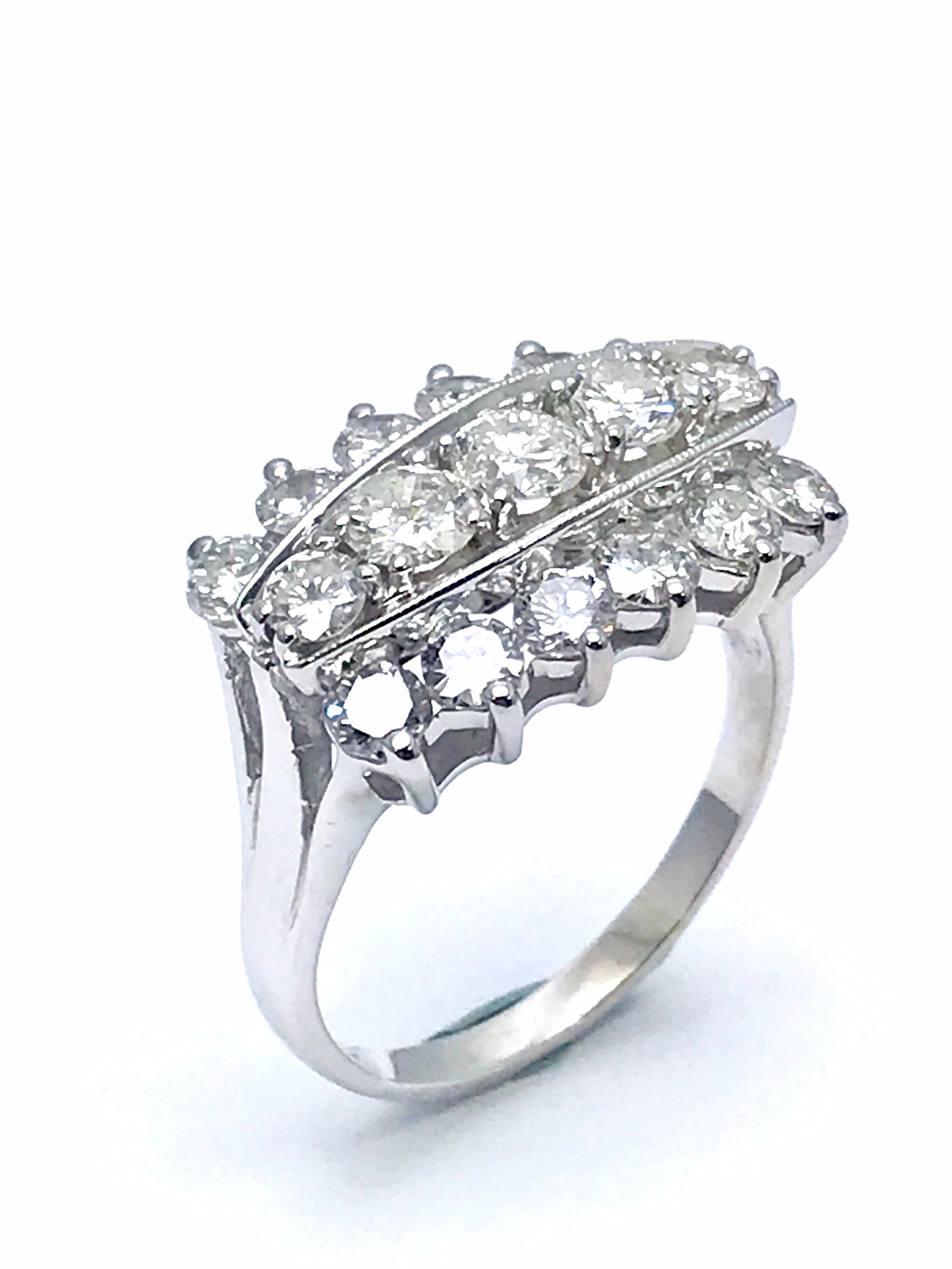 A fiery 2.00 carat total weight three row round brilliant Diamond right hand ring in 14 karat white gold.  The diamonds are all prong set, and slightly graduated toward the center.  They are graded as H color, VS2-SI1 clarity.  The ring is currently