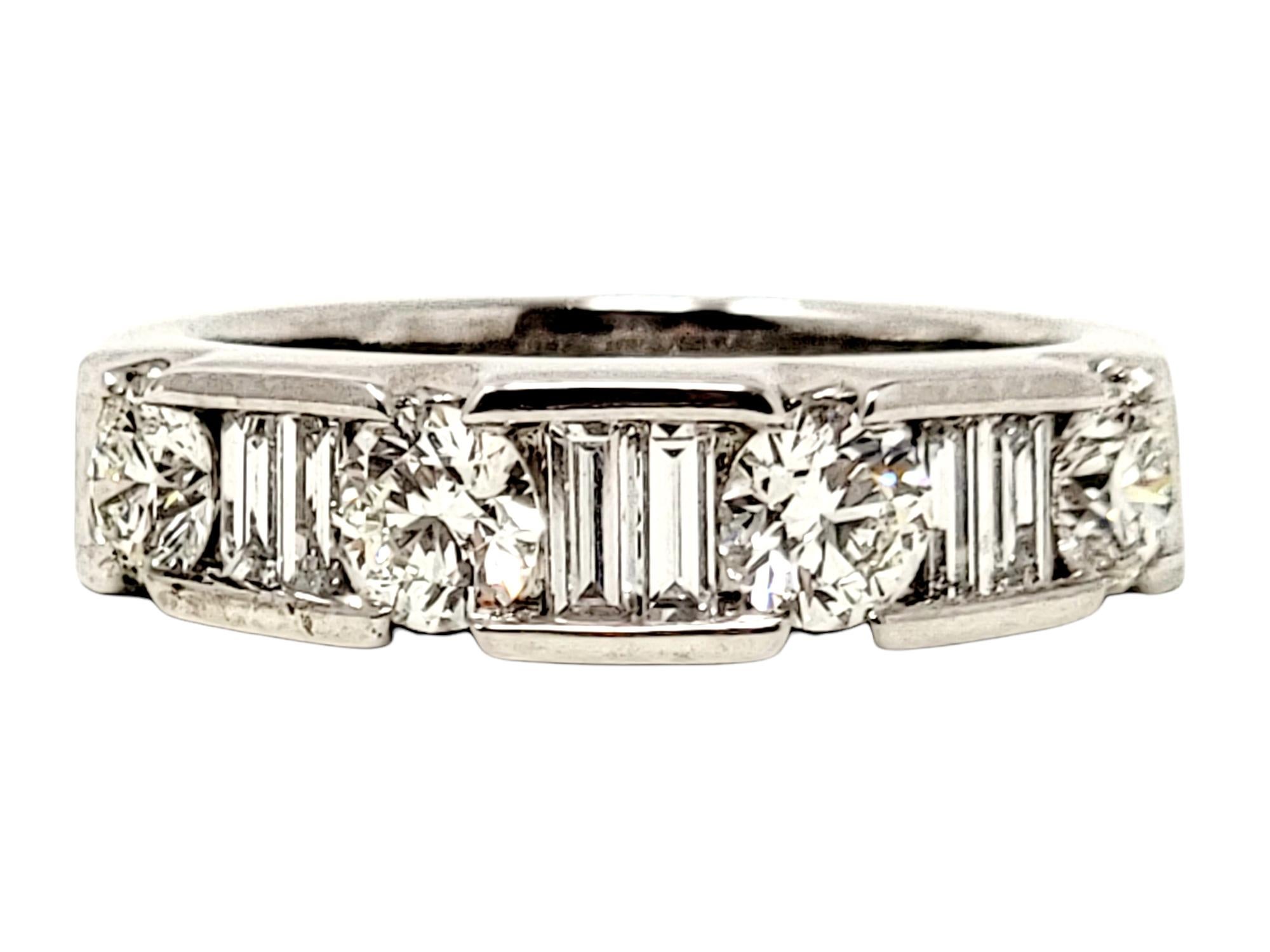 Ring size: 7

Stunning round and baguette diamond band ring. This sparkling beauty features icy white diamonds semi-channel set in a single row, with the stones set very close together for a continuous path of diamonds. Pair this versatile piece