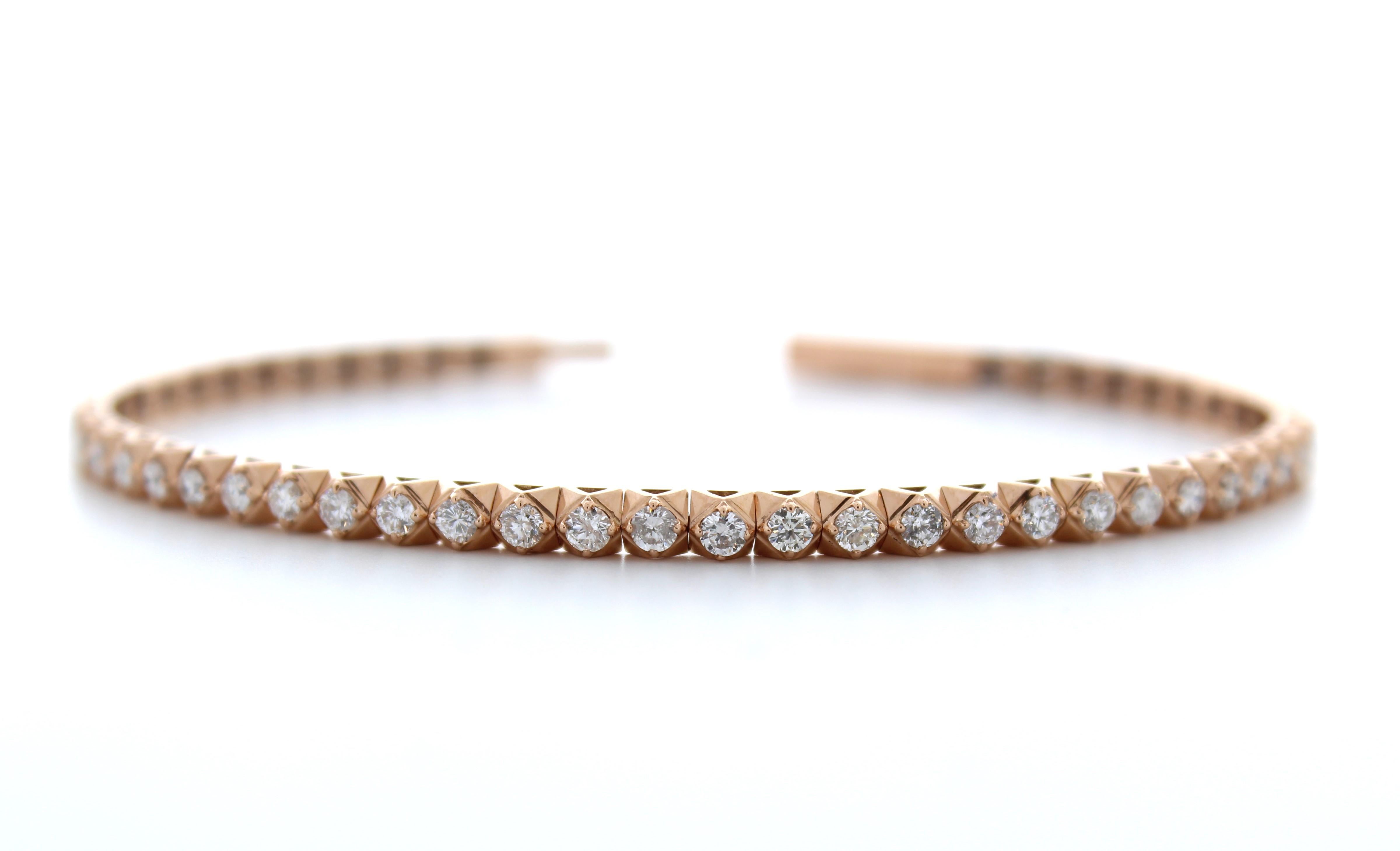 The 2.00 carat total weight fashion bracelet with 52 round diamonds in 14k rose gold is a stunning and elegant piece of jewelry that will add a touch of luxury to any outfit. The bracelet features 52 round diamonds with a total weight of 2.00