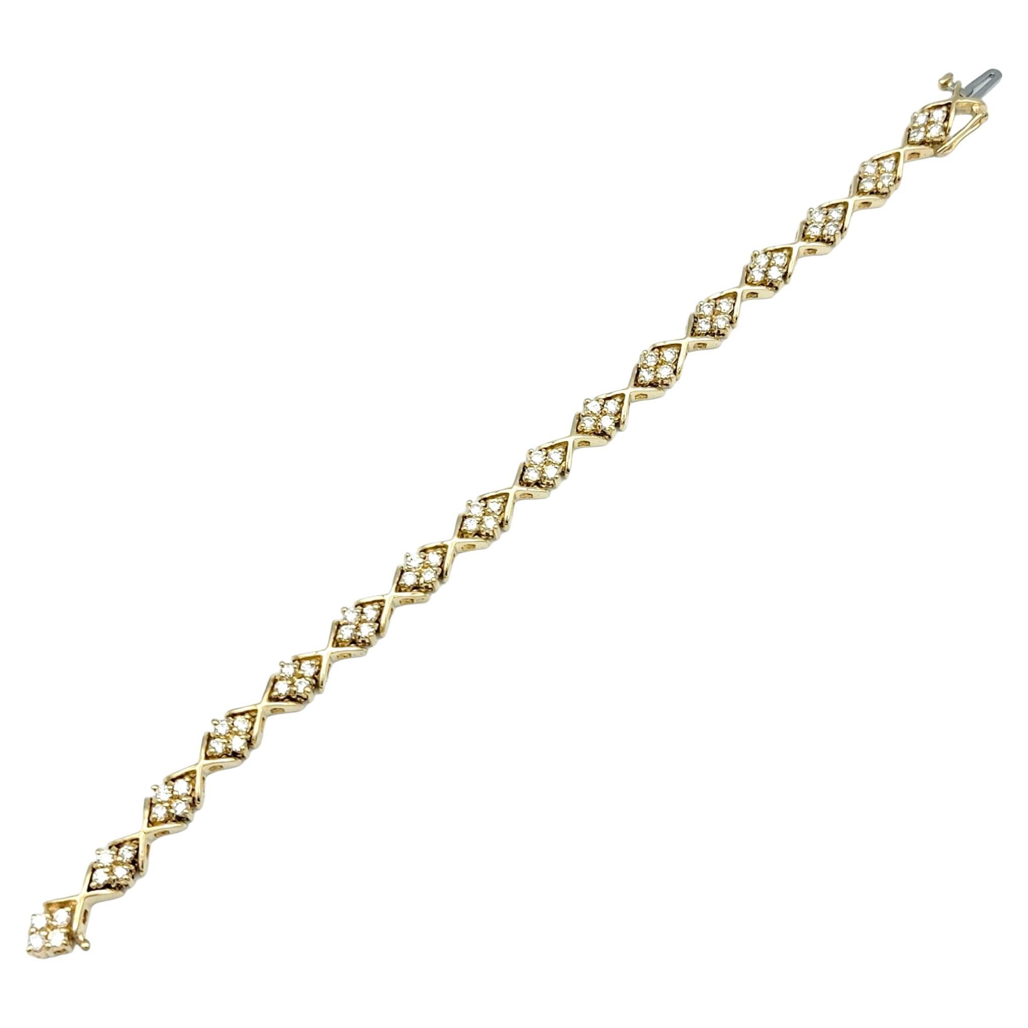 This gorgeous diamond link bracelet, elegantly set in radiant 14 karat yellow gold, exudes timeless charm and sophistication. Each link of the bracelet is meticulously crafted to alternate between two distinct motifs: a rhombus shape formation