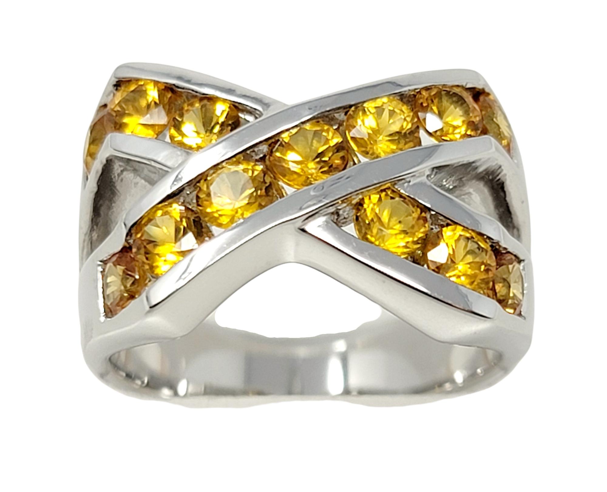 Contemporary 2.00 Carat Total Yellow Sapphire Channel Set Crossover X Band Ring 14 Karat Gold For Sale