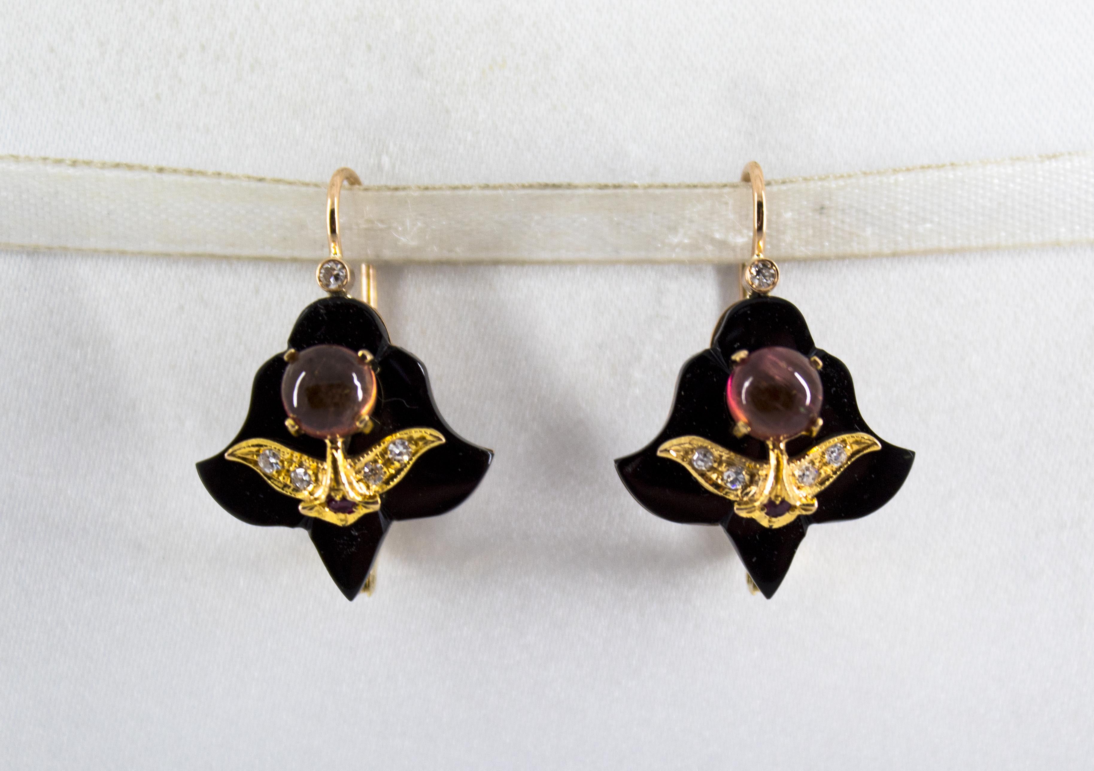 These Earrings are made of 14K Yellow Gold.
These Earrings have 0.20 Carats of White Diamonds.
These Earrings have 0.08 Carats of Rubies.
These Earrings have 2.00 Carats of Tourmaline.
These Earrings have also Onyx.
All our Earrings have pins for