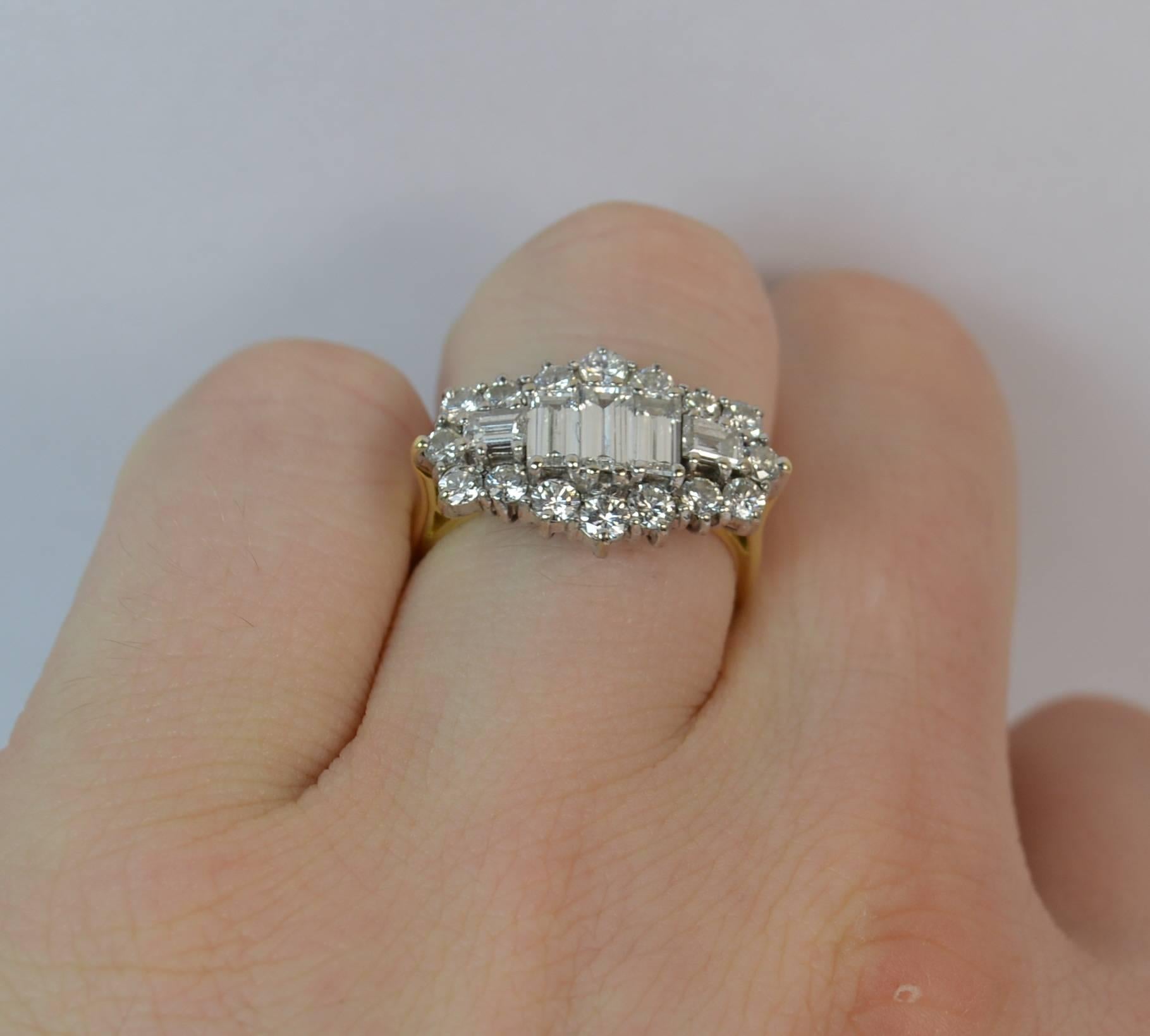 
A striking 2.00 carats of diamond and 18 carat gold ring.

​Designed with five emerald cut diamonds to the centre with sixteen round brilliant cut diamonds fully surrounding.

​20mm x 12mm head in white gold. Vs diamonds, very clean and sparkly