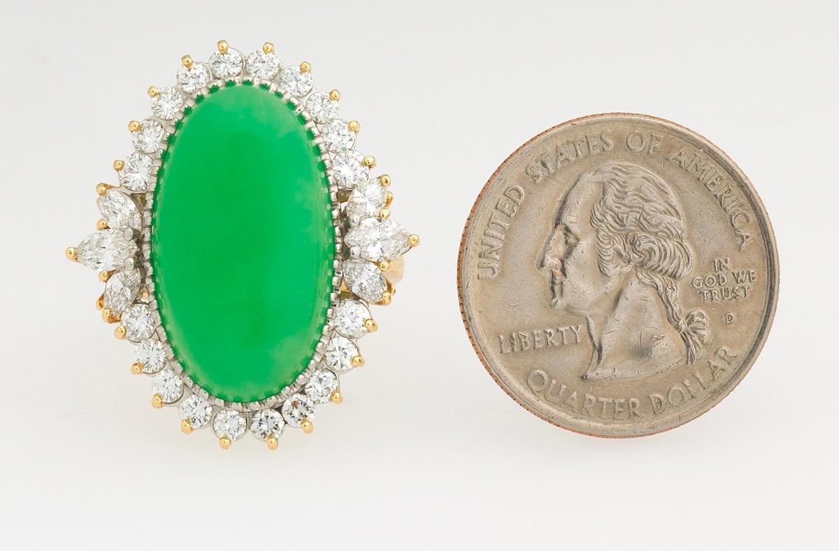 Gorgeous large 18k yellow gold and platinum ring set with an oval cabochon cut chrysoprase, 23.65mm x 13.42mm x 4mm.

The stone is surrounded by white G-H and fiery VS quality round brilliant and marquis cut diamond halo, total estimated diamond