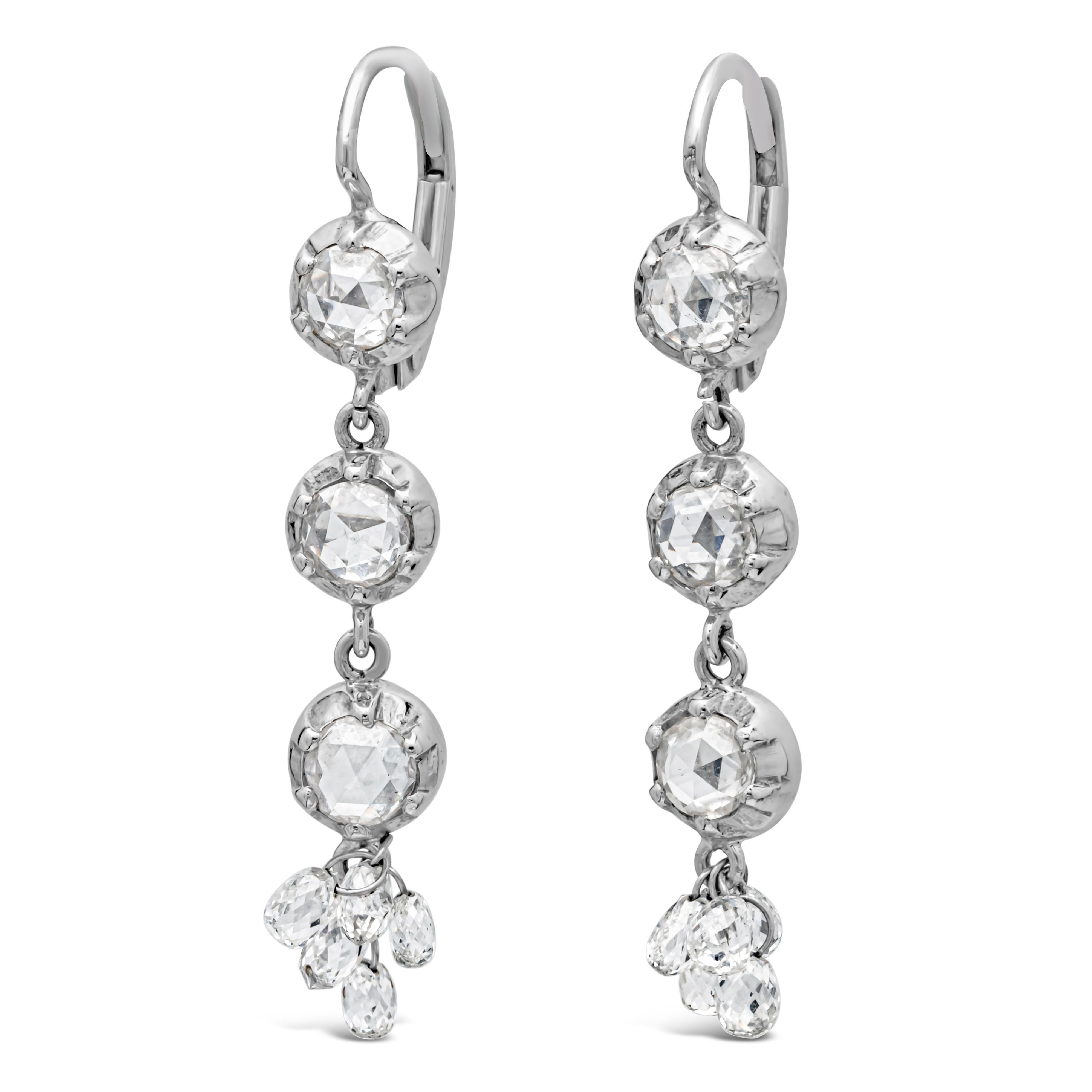 Showcasing a simple and classy 18k white gold drop earrings set with 6 brilliant round cut diamonds, accented by 10 dangling small briolette cut diamonds weighing 2.00 carats total, F color and VS in clarity. Hanging from a diamond encrusted 14k