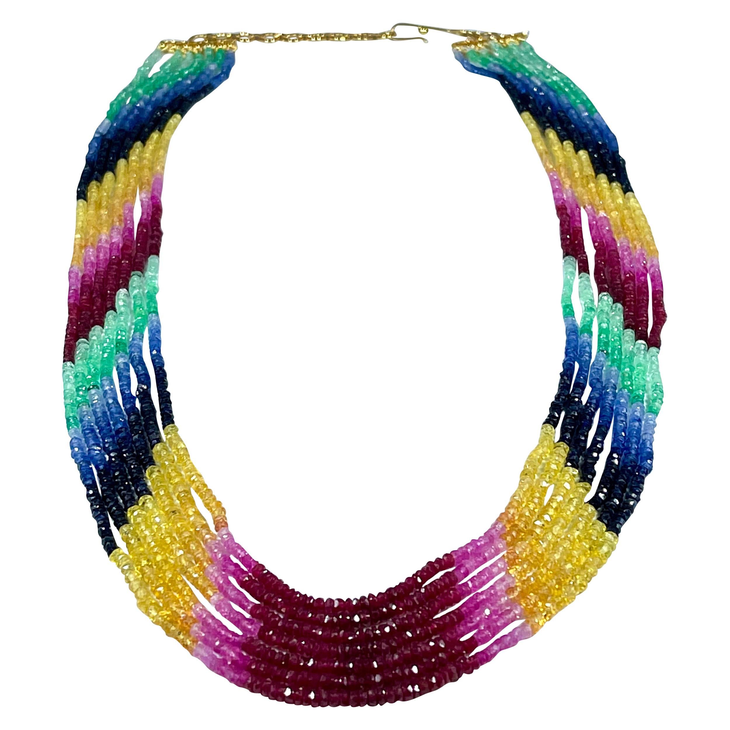 Approximately 200 Ct 7 Layer Faceted  Natural Emerald Ruby & Sapphire Bead Necklace  14 Karat Gold adjustable Clasp
This spectacular Necklace   consisting of approximately 200 Ct   of  Fine and natural beads of all precious stones ,,, Emerald , ruby