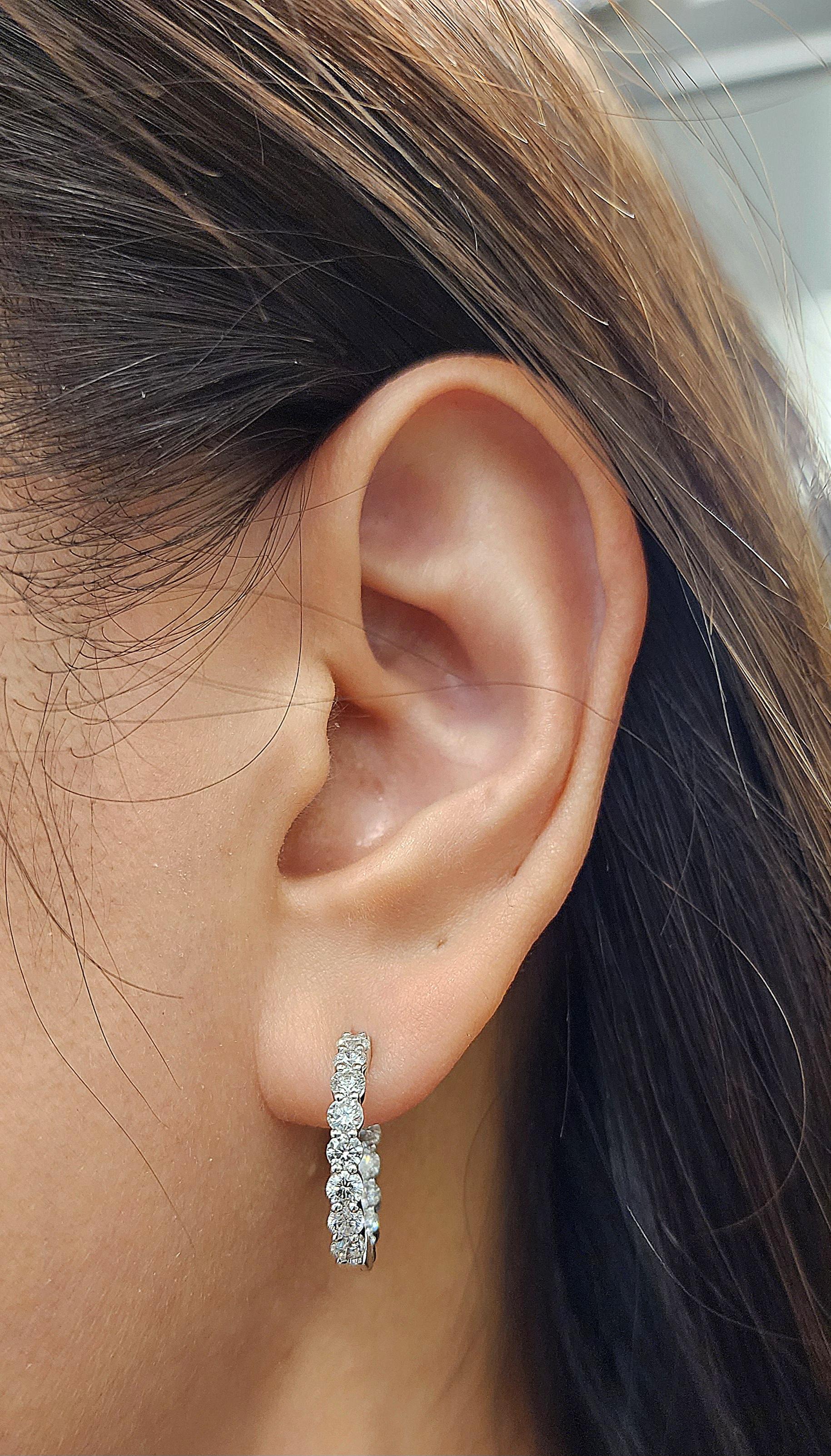 These 2.00 ct diamond hoop earrings are a great addition to any wardrobe. They feature 28 diamonds with a G/H in color and VS2/SI1 in clarity, making them a classic piece for any fashion-forward individual. The diamonds are set in a high-polish 18K