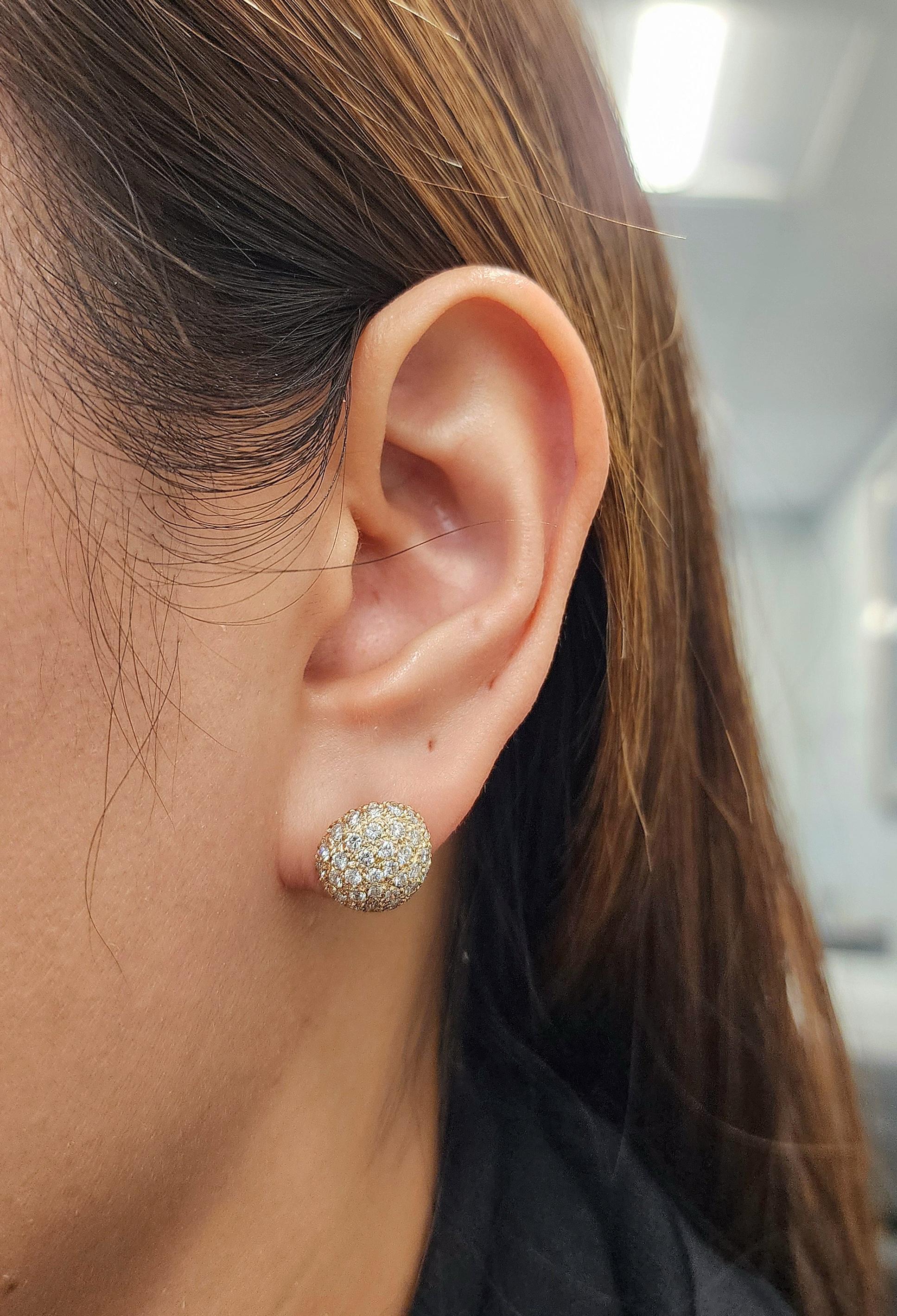 These gorgeous diamond earrings feature round diamonds weighing approximately 2.00 ct pavé set in 14k yellow gold. The diamonds are white, with a color grade of F/G and clarity of VS1/VS2. A modern piece crafted in the United States, perfect for any