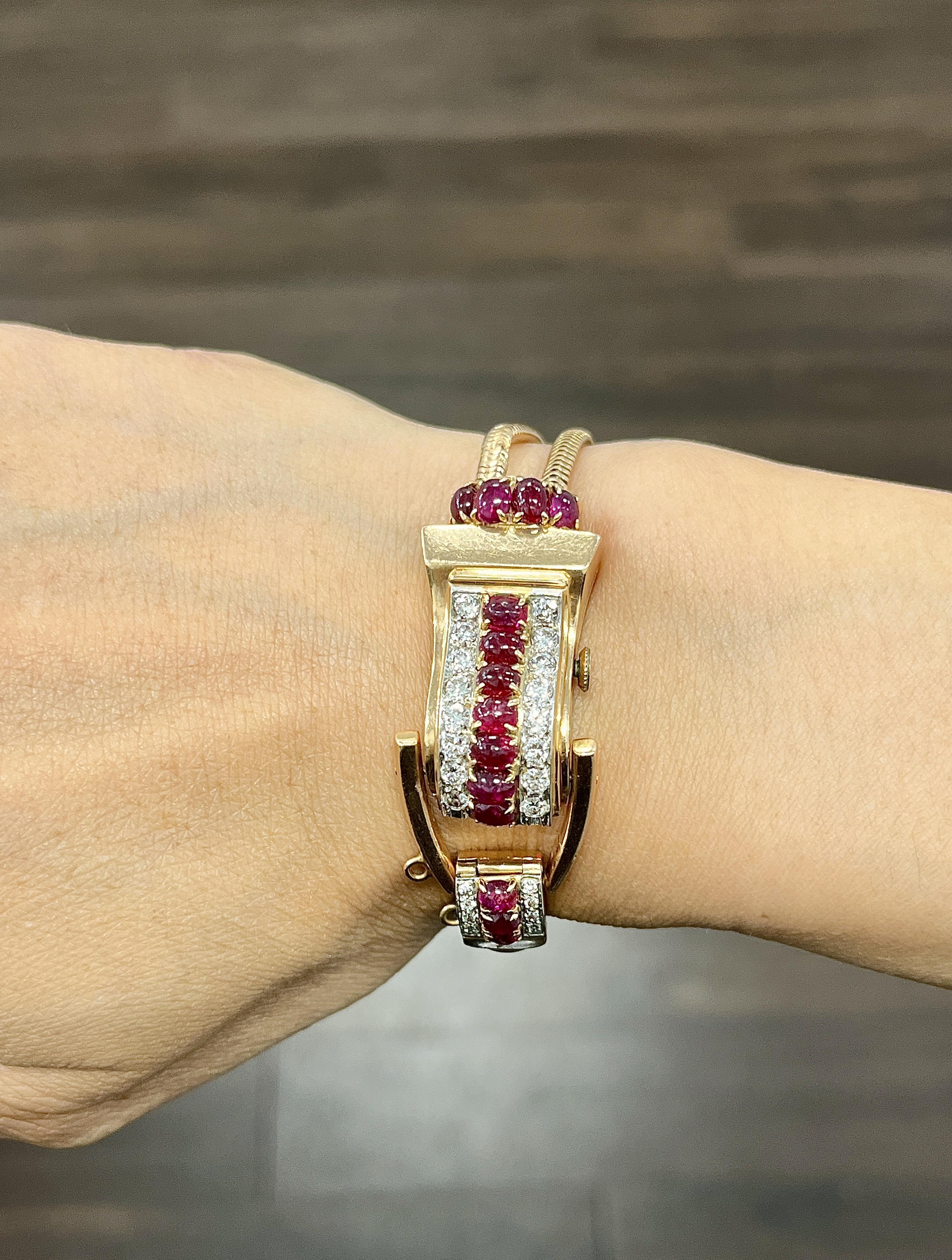 This elegant 18k yellow gold watch by Hamilton features an automatic movement. The timepiece is adorned with approximately 2.00 ct striking oval-cut natural Cabochon rubies and round-cut white diamonds. The diamonds are of G/H color grade and