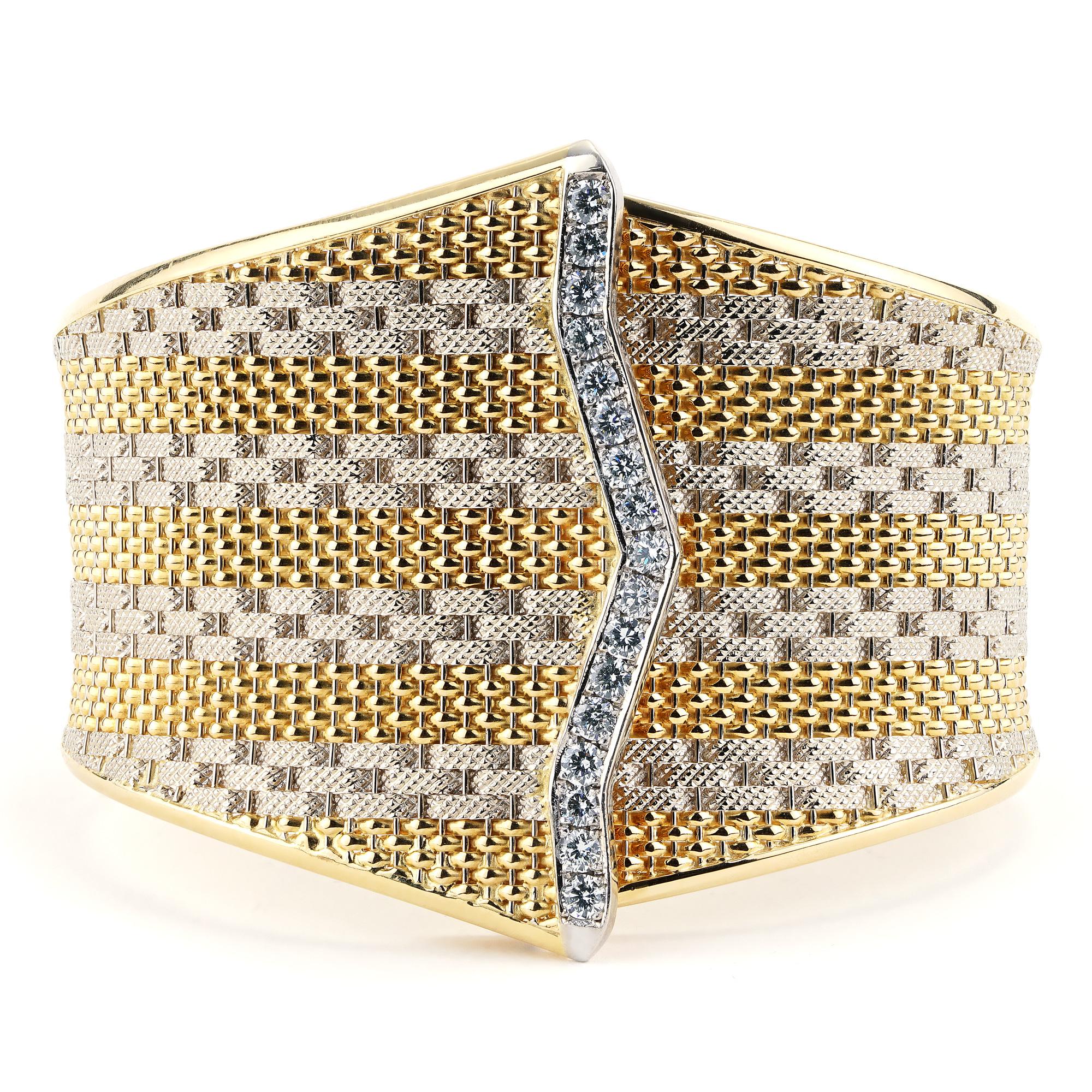 Elegance meets sophistication in this exquisite two-tone diamond bangle bracelet. Crafted from luxurious 18 karat yellow and white gold, this bracelet showcases a harmonious blend of warm and cool tones, adding a timeless appeal to any ensemble.

At