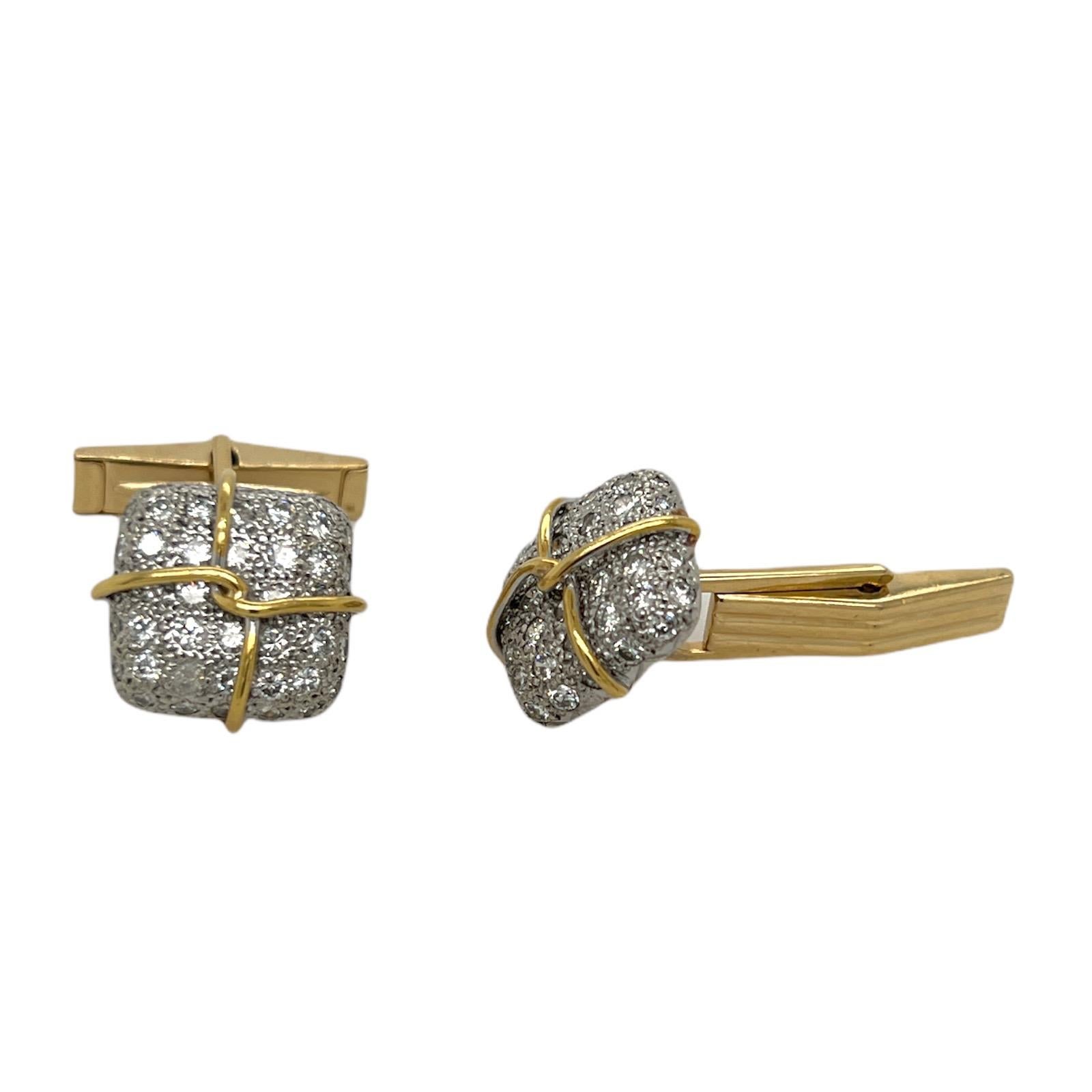 Diamond cufflink and stud set crafted in 14 karat white and yellow gold. The set features round brilliant cut diamonds weighing approximately 2.00 carat total weight and graded H-I color and SI clarity. The cufflinks measure 15 x 15mm, and the studs