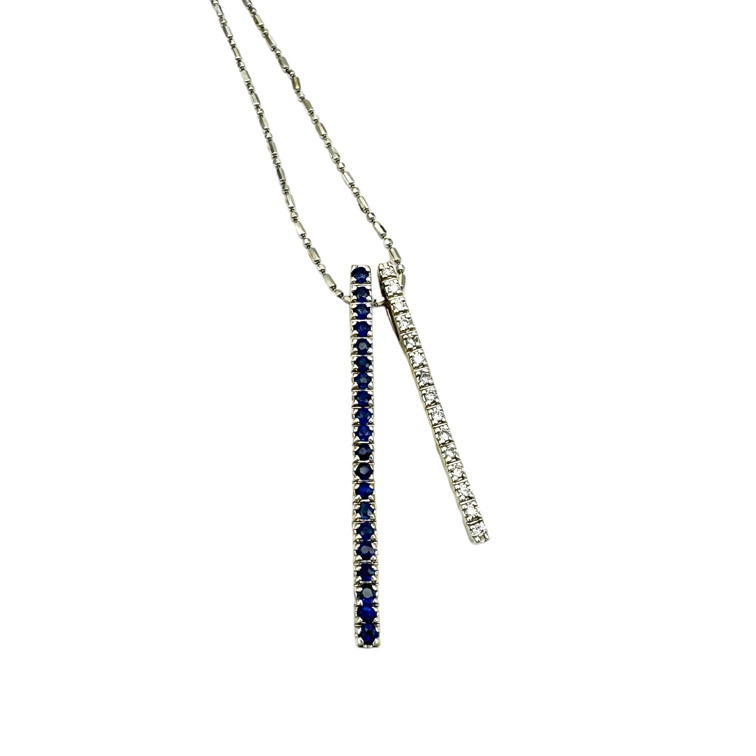 14 Karat white gold diamond pendant and earrings set in a double bar, pave setting. The two bars are set with sapphires and the other with diamonds ranging from 1.50 to 2 inches.
Approximately 85 sapphires and diamonds average 1.80-1.50 mm, having a