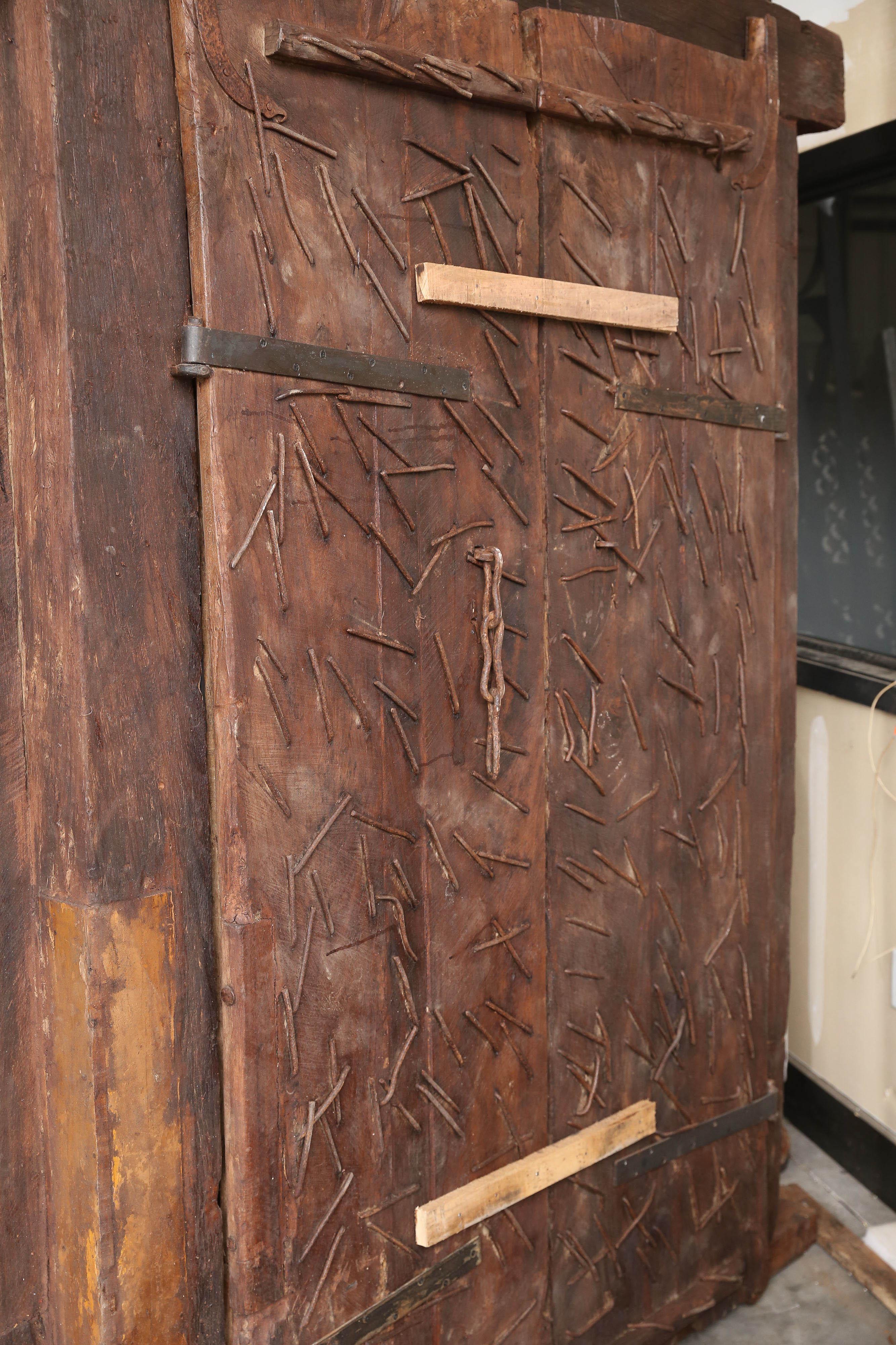 Early 19th Century 200 Years Old Highly Carved Metal Studded Grand Entry Door from a Mansion