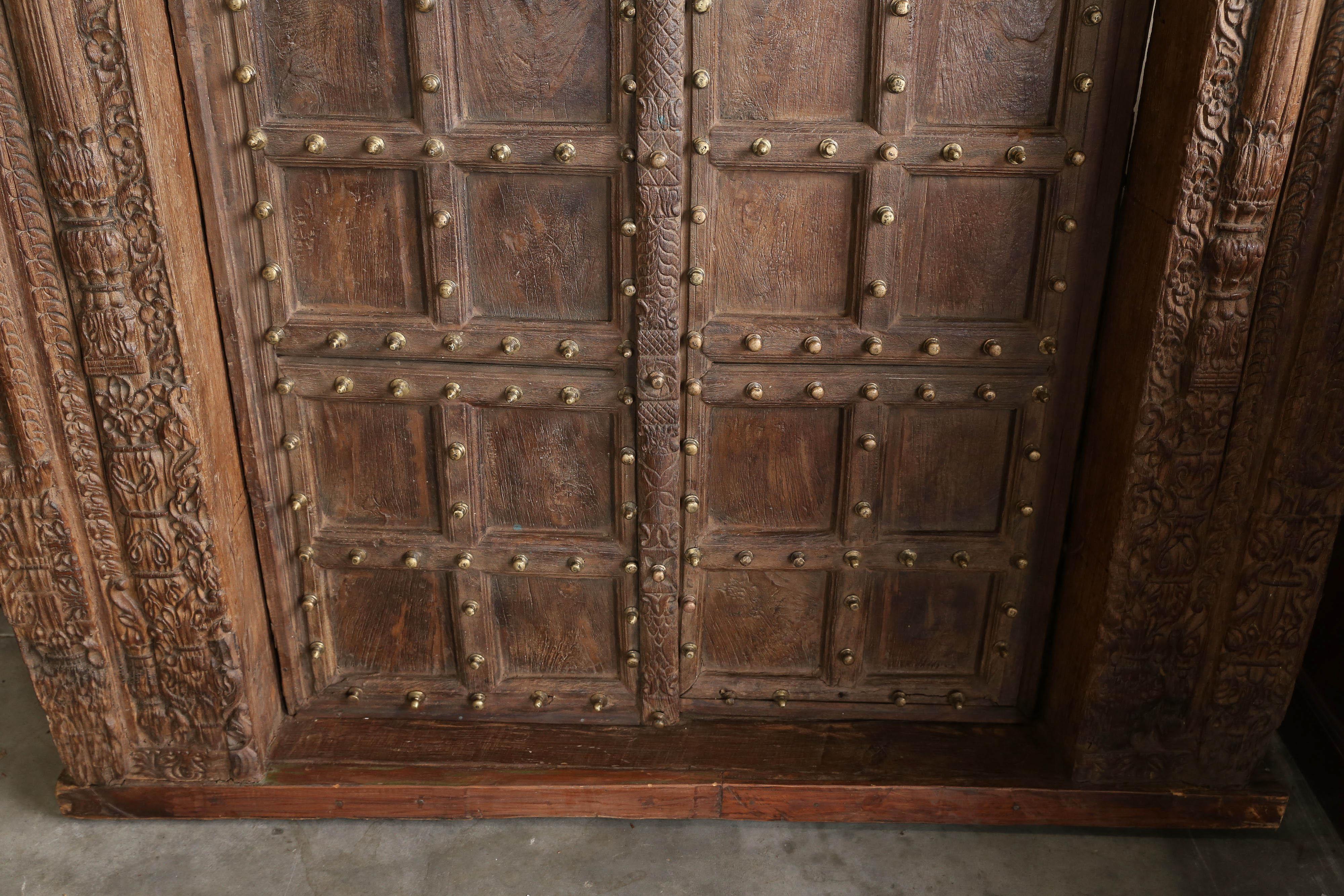 Hand-Crafted 200 Years Old Highly Carved Metal Studded Grand Entry Door from a Mansion